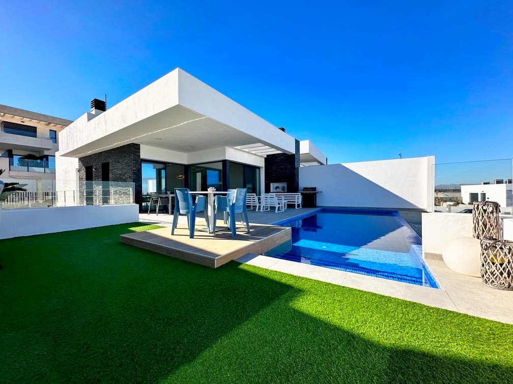 This luxury modern villa SKYLINE II situated in Rojales, has been designed with a lot of light and open spaces, with basement, garage, private pool, spacious terraces and landscaped garden to enjoy the Mediterranean climate year-round. The magnificent family home with cascading infinity pool enjoys excellent sea views with panoramic views of the Bay of Guardamar and Santa Pola. The property comprise three bedrooms with fitted wardrobes and en-suite shower rooms and 1 guest toilet, a fully-fitted modern integrated kitchen with breakfast bar and open-plan living/dining room, leading to the garden with covered outside dining space. The main floor has a double bedroom with dressing room. On the lower floor there is a large family room with underwater pool observatory. Two double bedrooms with access to the tropical patio garden, seating area and direct access to the garage area. A unique opportunity which invites you to enjoy Mediterranean life from the first moment.The complex is located near Ciudad Quesada in the municipality of Rojales, with panoramic views of the Mediterranean, the growing beaches of Guardamar and Santa Pola. A few meters from Pueblo Lucero is the Rojales La Marquesa golf course in Ciudad Quesada, just five minutes from the beautiful beaches of Guardamar del Segura and practically walking distance from the center of Rojales.In the center of the town there is a very pretty church, a local museum and a lovely town square where you can sit and watch the world go by.