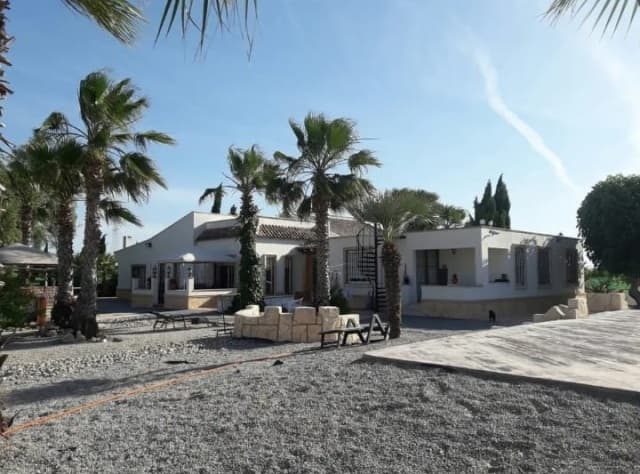 This finca offers many possibilities, is very spacious and located in a quiet area. Can possibly be converted to B & B.

Large domain with very large swimming pool, jacuzzi, BBQ, paddock with stables, sports facilities, in short, very functional and suitable for many purposes.

7 bedrooms, 3 bathrooms, 3 lounges, fully equipped kitchen, garage, storage space, large terraces, etc.

Equipped with heating and air conditioning.

Furnished!

Located near the historic town of Orihuela, about 30 km from the beautiful beaches of Guardamar, 45 km from Torrevieja and 30 minutes from Alicante airport.

Contact us for more information or viewing.



