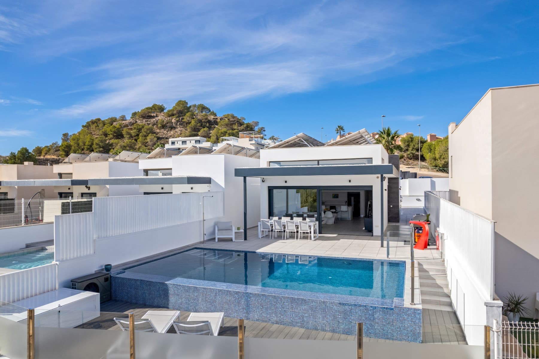 

Stylish High-Tech Villa with Panoramic Sea View!

Experience ultimate luxury in this modern and high-tech villa with breathtaking views of the sea and the pink lagoon. This recent villa located 2 km from San Miguel de las Salinas and in the vicinity of golf courses offers everything you are looking for: space, comfort and advanced technology.

 Features: 272 m² built on a plot of 411 m² 4 spacious bedrooms & 4 luxurious bathrooms Two living rooms with a ceiling height of 3.5 m Infinity pool (8x4) with heating & electric cover Private parking for 3 vehicles + charging point. 22 solar panels for optimal energy consumption 5-zone air conditioning & heating system 5-point camera system & privacy fencing

Home automation throughout the home.

 Extra luxury details: Underfloor heating and radiators in all bathrooms Motorized roller shutters & mosquito screens throughout the house Water softener for both the home and the pool Pellet stove for extra warmth and atmosphere and also professional humidity control

 A unique opportunity to live in a top-class villa with maximum energy efficiency and comfort!

Interested? Contact us for a viewing!