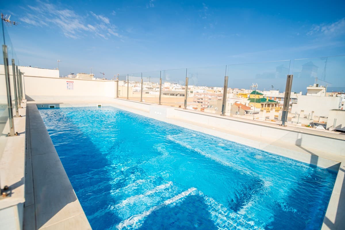 For Sale: Modern 3-Bedroom Ground Floor Apartment in Torrevieja – Just 50m from Playa del Cura!

Live the dream just 50 meters from the beautiful Playa del Cura beach in this stunning, fully furnished 3-bedroom ground floor apartment. Offering a modern lifestyle with all the comforts, this property is perfect for those seeking a stylish home in an unbeatable location.

Key Features:

3 Bedrooms – Spacious and bright, ideal for family living or guests.2 Bathrooms – Including a luxurious en-suite to the master bedroom.Fully Furnished – Move-in ready with modern, stylish furniture.Fully Equipped Kitchen – Appliances included for easy living.Ground Floor Location – Easy access with no stairs, perfect for all ages.Communal Roof-Top Pool – Enjoy stunning views and relax by the pool, just a step away.Elevator Access – Easy access to all floors, including the rooftop pool.Prime Location – Just 50 meters from Playa de los Locos beach, perfect for a coastal lifestyle.

Extras:

Storage – Available for purchase at a later stage, offering added convenience.

This apartment offers both luxury and practicality, with all the local amenities, restaurants, and shops nearby. Don't miss out on this fantastic opportunity to live steps away from the beach with access to amazing facilities!

Contact us today to schedule a viewing and make this beautiful coastal property yours!