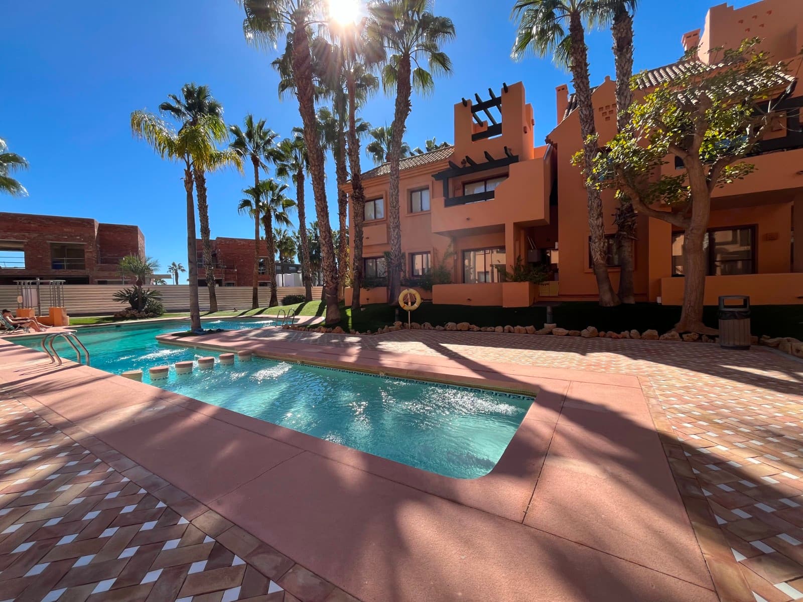 Modern apartment with 2 bedrooms, 2 bathrooms and 2 terraces

 Discover this beautiful 2-bedroom, 2-bathroom apartment located in an exclusive residence with a communal swimming pool. The house offers a perfect balance between comfort, elegance and a relaxed Mediterranean lifestyle.

 Inside you will find a bright living room with direct access to one of the spacious terraces, ideal for enjoying the Spanish sun or an al fresco dinner. The modern kitchen is fully equipped and practically laid out. Both bedrooms are spacious and feature built-in wardrobes, and the master bedroom has an en-suite bathroom.

 The apartment has two terraces, so you can choose between sun and shade at any time of the day. In addition, an underground garage and a private storage room are included in the price.

 In the exclusive Nueva Ribera Beach Club urbanization in Los Alcázares you can enjoy the best that the Mar Menor has to offer. Located directly on the beach, this stylish residence combines modern comfort with a relaxed Mediterranean lifestyle. The gated community offers 24-hour security, beautifully landscaped gardens and an inviting communal swimming pool, all designed to maximise your enjoyment of peace, space and sea views.

 The area offers countless opportunities for relaxation and enjoyment. Along the boulevard, you'll find cozy bars, restaurants, and cafés where you can enjoy Spanish cuisine and a lively atmosphere. For daily shopping there are supermarkets and shops in the immediate vicinity, easily accessible on foot or within a few minutes by car.

 For sports enthusiasts, the location is ideal: on the shores of the Mar Menor you will find several water sports schools where you can go windsurfing, kayaking, SUP or sailing. In addition, there are several golf courses within a short drive, perfect for those who enjoy being active in the outdoors.

 Accessibility is excellent: the Región de Murcia (Corvera) airport is only about 40 kilometres away, making travel quick and easy. The nearby towns of San Javier, Cartagena and Murcia are also easily accessible by motorway.

 Living at Nueva Ribera Beach Club means choosing quality, comfort, and a unique location right on the beach. Here you'll enjoy sun, beach, and a relaxed lifestyle every day in a safe, well-maintained, and exclusive environment.

