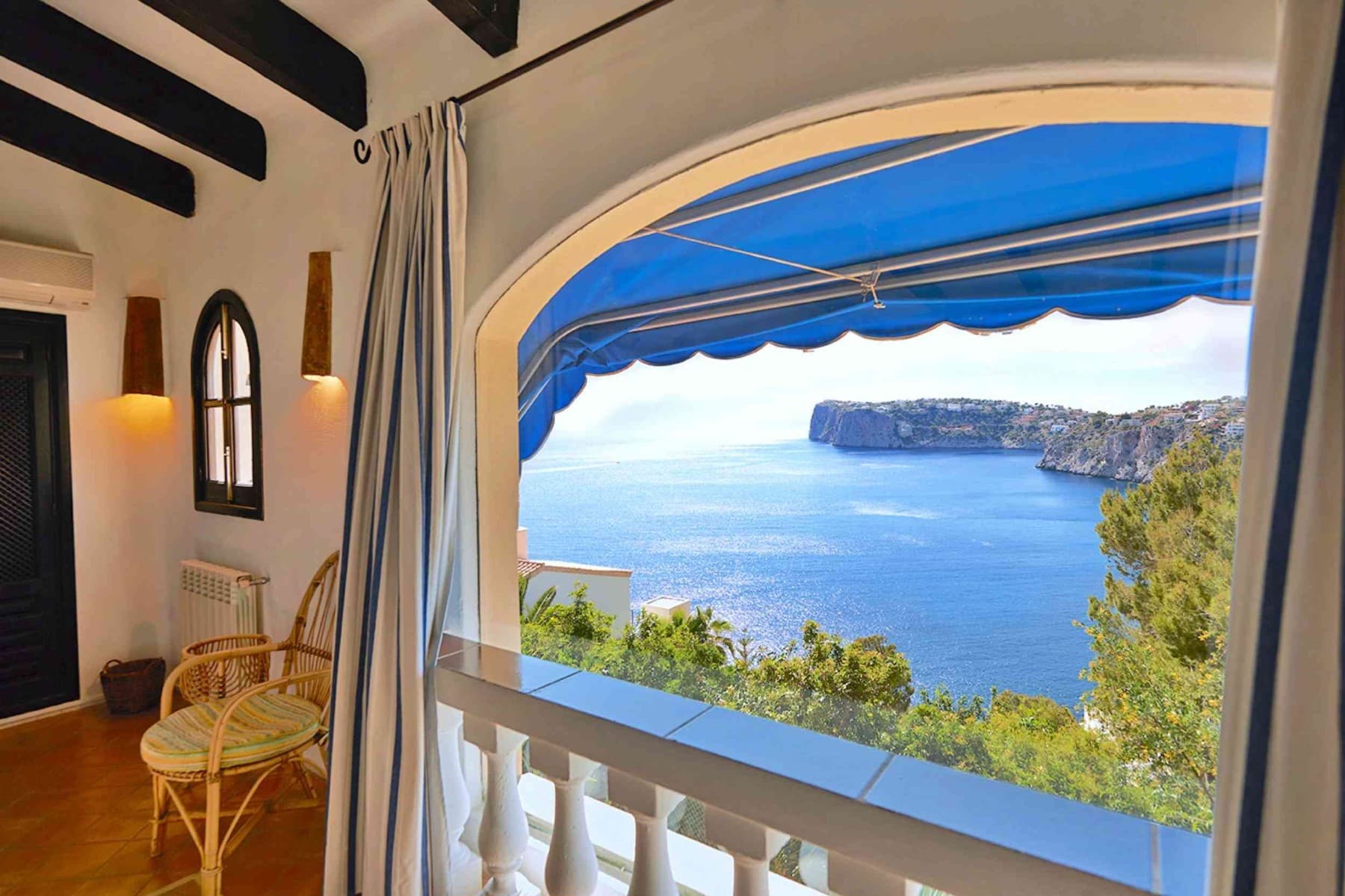 The Mediterranean villa with vacation rental license (ETV) offers on a constructed area of approx. 247m² (approx. 228m² constructed living space), concluded of two separate apartments with the following layout.First floor apartment (approx. 150m²): Living room, dining area with fireplace, kitchen, 2 bedrooms, 1 bathroom, covered terrace, open terraces, sea viewsUpper floor apartment (approx. 78m²): Living/dining room with fireplace, kitchen, 2 bedrooms, 1 bathroom, open terraces, sea viewOutdoor area: small swimming pool, large open and covered terraces, roof terrace, landscaped gardens, garage for 1 carThe property can be used in its current layout or the two floors can be connected with an internal staircase.The neighboring house of a similar size can also be purchased. However, the neighboring house does not have a rental license.Let us show you this special property now, in person or through an online viewing!