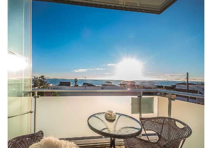 This lovely townhouse is situated in 100 metres from central Guardamar beach and has beautiful open sea views. 247 sq.m. of built area distributed between 3 levels - basement, ground floor and 1st floor. The kitchen, living rooms and guest toilet are located o the ground floor. Master bedroom with walk-in closet and a balcony, another single bedroom with built-in wardrobe and common bathroom are located on the 1st floor. 2 more bedrooms with common bathroom and second living room are in the basement level. Also in the basement there is a big patio, which brings in natural light to all the rooms. The access to the private underground garage with storage room is also located in the basement level. This townhouse also has a roof terrace with amazing panoramic views.It is a corner townhouse which is surrounded by a huge private terrace. There is communal swimming pool available in the residential. All furniture and white goods are included in the price (except for main lounge sofa and lamps). This property was built using top quality materials, hence is absolutely suitable for permanent living. High quality, double glazed thick windows ensure comfortable temperature in the house throughout the year without the need of using heating or air conditioning. Centralised air conditioning system is pre-installed in the house. Motorized shutters on windows, automatic garage door. Very convenient location, with all necessary amenities and services available in walking distance.