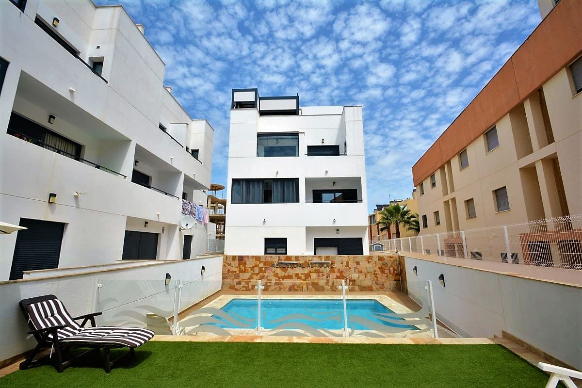 Fantastic 2-storey apartment situated in a gated residential of 16 properties, communal pool and underground parking. This property boasts top quality finishes and equipment. It has a superb orientation, facing South, which makes it very bright and sunny. Sea views from the roof terrace! An amazing place to enjoy Mediterranean climate in full tranquility, yet in walking distance to all the amenities of cozy Spanish town - Guardamar del Segura.

The access door to this property is located on the first floor of the residential. The total constructed area is 91 sq.m. distributed between 2 levels. Additionally this apartment has a private roof terrace (34 sq.m.). On the main floor you will find guest toilet, spacious living room with open type kitchen, dining area with a foldable table and a glazed balcony with pool views. Fully equipped kitchen with lots of storage space and all necessary appliances such as: dishwasher, fridge, washing machine, coffee machine, ceramic hob, oven, extractor fan and electric water heater.

On the second floor of this property you will find the master suite with access to a glazed balcony and a private bathroom with window, a room that used as a big walk-in closet, another double bedroom with built-in wardrobes, second bathroom with shower and a window and a large wardrobe place in the corridor between bedrooms. Both bedrooms have TVs.

The roof terrace is equipped with the most modern motorized awning and side blinds for total privacy. The terrace is split into 2 areas, one of which has a roof that can be totally opened and closed and the other part, has a fixed aluminium awning which can be partially opened. All blinds and awnings are controlled by a remote control. Also, you will find a huge gas barbecue,a small charcoal grill, kitchen worktop with a sink and lots of cabinets for storage, and a small fridge. The is a summer shower on the roof terrace for hot summer days. Pre-installation for a TV and full installation of CCTV with video cameras with sound. This property has a full installation of 2 very powerful air conditioning machines for each floor. The AC has cooling and heating modes. Also, high quality solar panels are installed on the roof generating electricity for entire house during whole year. All the furniture, kitchen appliances, TVs and other installations are included in the price. This property comes with an underground parking space included in the price. Built in 2019 and has been barely used by current owners.10% ownership transfer tax and other purchase costs are not included in the price. 

The residential is situated in the peaceful area of Los Secanos of Guardamar del Segura. Short drive to Guardamar town centre, 10-minute walk to the beach, 35-minute drive to Alicante airport. 

Please do not hesitate to contact us if you have any questions or wish to view this wonderful property!

Guardamar del Segura, often referred to simply as Guardamar, is a charming coastal town located on the beautiful Costa Blanca in Spain. Known for its stunning blue-flag beaches, lush natural parks, and a rich cultural heritage, Guardamar is a hidden gem waiting to be discovered. With its Mediterranean climate, picturesque seaside promenades, and a laid-back atmosphere, it's the perfect destination for relaxation and outdoor enthusiasts. Explore historic sites, indulge in local cuisine, or simply soak up the sun on its golden sandy shores. Guardamar del Segura invites you to experience the true essence of coastal Spanish living.