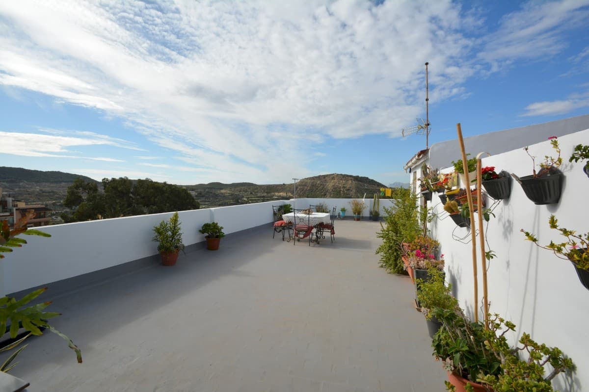 Nestled in the vibrant heart of Guardamar del Segura, this property offers an unparalleled opportunity to experience the best of coastal living. Guardamar is renowned for its stunning beaches, picturesque pine forest, and a strategic location just a short drive from Alicante city and its international airport, making it a prime destination for relaxation and convenience.Spanning 124 m² of constructed space, this exceptional apartment also features a 10 m² covered terrace and an expansive private rooftop terrace of approximately 80 m². Currently configured with three bedrooms and two bathrooms, the layout includes a bright living room with an open kitchen and a separate lounge area, which can be easily transformed into a fourth bedroom or combined with the adjacent bedroom to create a luxurious master suite. Designed on a single level, this unique property occupies the entire fifth floor of the building, offering unmatched privacy.With all windows facing outward and each room opening onto a long wraparound balcony, the apartment boasts unobstructed, lifetime-guaranteed views, including glimpses of the sea. Positioned just 600 meters from the beach on the main street of town, its east, south, and west orientation ensures abundant natural light throughout the day. The airy living room, complete with a functioning fireplace, enhances the cozy yet spacious ambiance.The property offers ample storage both within and outside the apartment, and low communal costs add to its appeal. Although some renovation is needed, this rare find is situated in a building that stands out in Guardamar, where five-story constructions are no longer permitted, securing its light and views for the future.Convenience is a cornerstone of this property, with a large free parking area next to the building, all essential amenities within walking distance, and CCTV cameras ensuring added security. Tax and other expenses are not included in the listed price. For further details or to arrange a viewing, please do not hesitate to contact us.