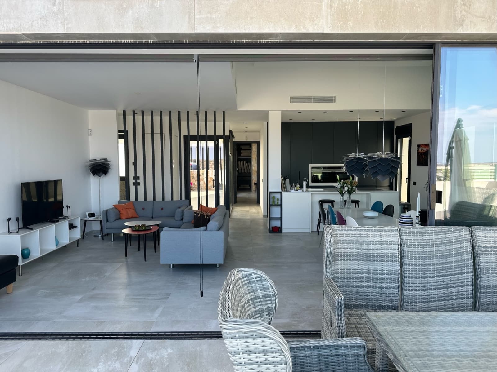 This modern villa, built in 2020 and located in Ciudad Quesada, is absolutely stunning and offers an abundance of luxury and comfort. With its contemporary architecture and high-quality finishes, it is a home that perfectly suits those looking for a stylish and comfortable living space.

Highlights of the Villa:

4 Bedrooms and 4 Bathrooms: Spaciously designed with enough room for a large family or guests. The ground floor features a large living room with an open kitchen.Seamless Indoor-Outdoor Transition: Large sliding windows to the terrace and pool provide a seamless transition between indoor and outdoor living, while you enjoy the beautiful views over the skyline of Guardamar and the Mediterranean Sea.Luxury Amenities: This villa is equipped with electric shutters, an infinity pool with a waterfall, a separate technical room, a garage with an automatic gate, a storage room, a separate laundry room, and a multipurpose room.High-Quality Finishes: The careful finishes and meticulously chosen details give the house an extra appeal and cachet.

Functional and Stylish Interior:

Fully Equipped Kitchen: The kitchen is functional and fully equipped with warm colors and high-quality appliances.High-Quality Bathrooms: The bathrooms and the separate guest toilet are of the same high quality. The master bedroom has an en-suite bathroom and a walk-in closet.Underground Space: Thanks to a patio, the underground space receives beautiful daylight, making the bedrooms there extra attractive.

Ideal Location:

Close to Nature and Golf: The villa is conveniently located near the El Recorral nature park and the 18-hole golf resort La Marquesa.Close to Facilities: Rojales, a typical Spanish village situated on the Segura River, is just 25 minutes from Alicante airport. All facilities such as supermarkets, bars, restaurants, and a medical center are within 2 minutes reach.

Inmediately Available

The property is immediately available, offering a great opportunity for those looking for a home in Ciudad Quesada and wanting to enjoy the luxury and comfort this villa has to offer right away.

Your new luxury life begins here! Schedule a viewing today and discover for yourself the unique charm of this modern villa.