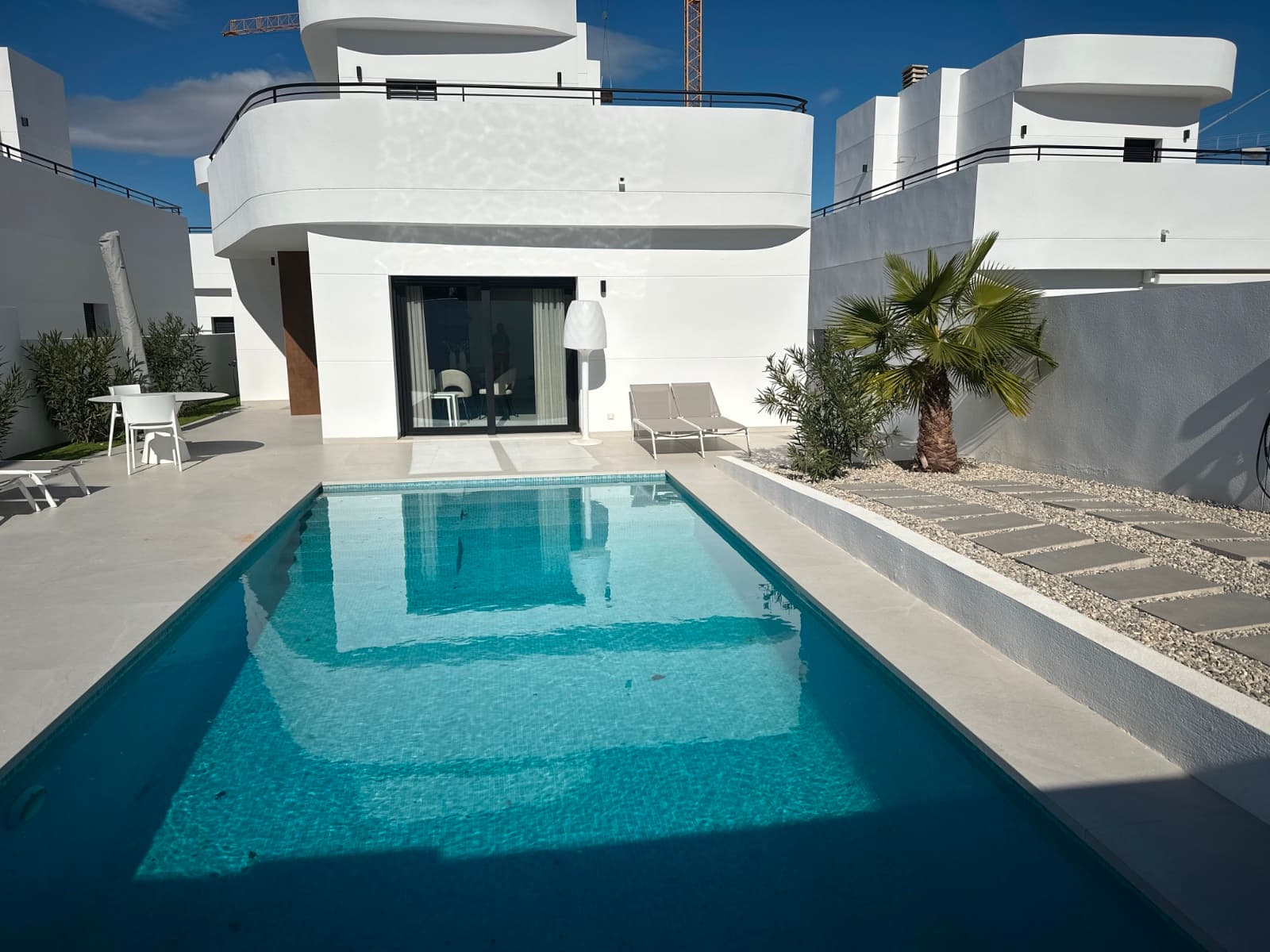 Modern Villa with 4 Bedrooms and 3 Bathrooms – Move-In Ready

Luxury Living with Furniture and Top Amenities Included

Discover this stunning villa, built in August 2024, located within walking distance of the renowned Golf La Marquesa and various other amenities. This contemporary home combines comfort, luxury, and functionality and is situated in a modern, newly built neighborhood.

Property Highlights

Spacious Layout: The villa offers 4 large bedrooms and 3 stylish bathrooms, ideal for families or hosting guests.Fully Furnished: Sold with all modern and tasteful furniture included, allowing you to enjoy your new home right away.South-Facing Orientation: Enjoy maximum natural light and a pleasant ambiance indoors and outdoors.

Exceptional Outdoor Living

Fully Landscaped Garden: A beautifully maintained garden provides a serene spot to relax and enjoy the Mediterranean climate.Heated Pool: Indulge in year-round luxury with a heated pool, perfect for relaxation or exercise.Sustainability: Equipped with 8 solar panels, the villa is energy-efficient and environmentally friendly.

Prime Location

This villa is ideally located in a modern new-build area, just minutes' walk from Golf La Marquesa. Additionally, numerous amenities, including restaurants, shops, and recreational opportunities, are within easy reach.

A Complete Package

This villa is move-in ready and meets all your expectations. Enjoy carefree living in a stylish environment with everything you need at your fingertips.

Don't miss out! Schedule a viewing today.