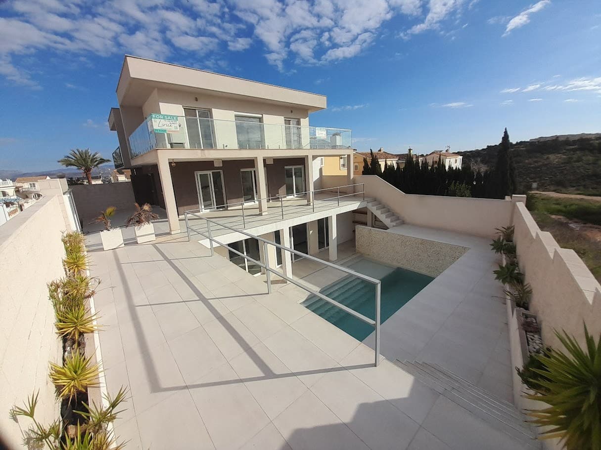 Luxury, Space, and Privacy on the Mediterranean

This stunning designer villa with 4 bedrooms and 4 bathrooms offers a unique combination of luxury, comfort, and breathtaking views of nature. Built in 2018, the villa features a private pool and is designed for ultimate relaxation and exclusivity.

This property is a perfect choice for those seeking space, tranquility, and privacy, close to the Mediterranean Sea and the vibrant city of Alicante.

Excellent Location in Gran Alacant

The villa is located in the modern residential area of Gran Alacant, with excellent accessibility and amenities:

Only a 10-minute drive from Alicante-Elche (El Altet) International Airport15 km north of Alicante, a city full of culture, shopping, and gastronomy6 km south lies the charming fishing village of Santa Pola, known for its harbor and seafood restaurantsSituated on the edge of a stunning natural reserve, perfect for walks and relaxation

Close to the Beach and Amenities

Just a few minutes’ drive away is the beautiful Carabassi sandy beach, a 4 km wide, gently sloping beach perfect for families.The residential area has its own shopping center with various bars, restaurants, and supermarkets, ensuring everything is within easy reach.

Experience the Mediterranean lifestyle in this exclusive villa!

Interested? Contact us for more information or a viewing!