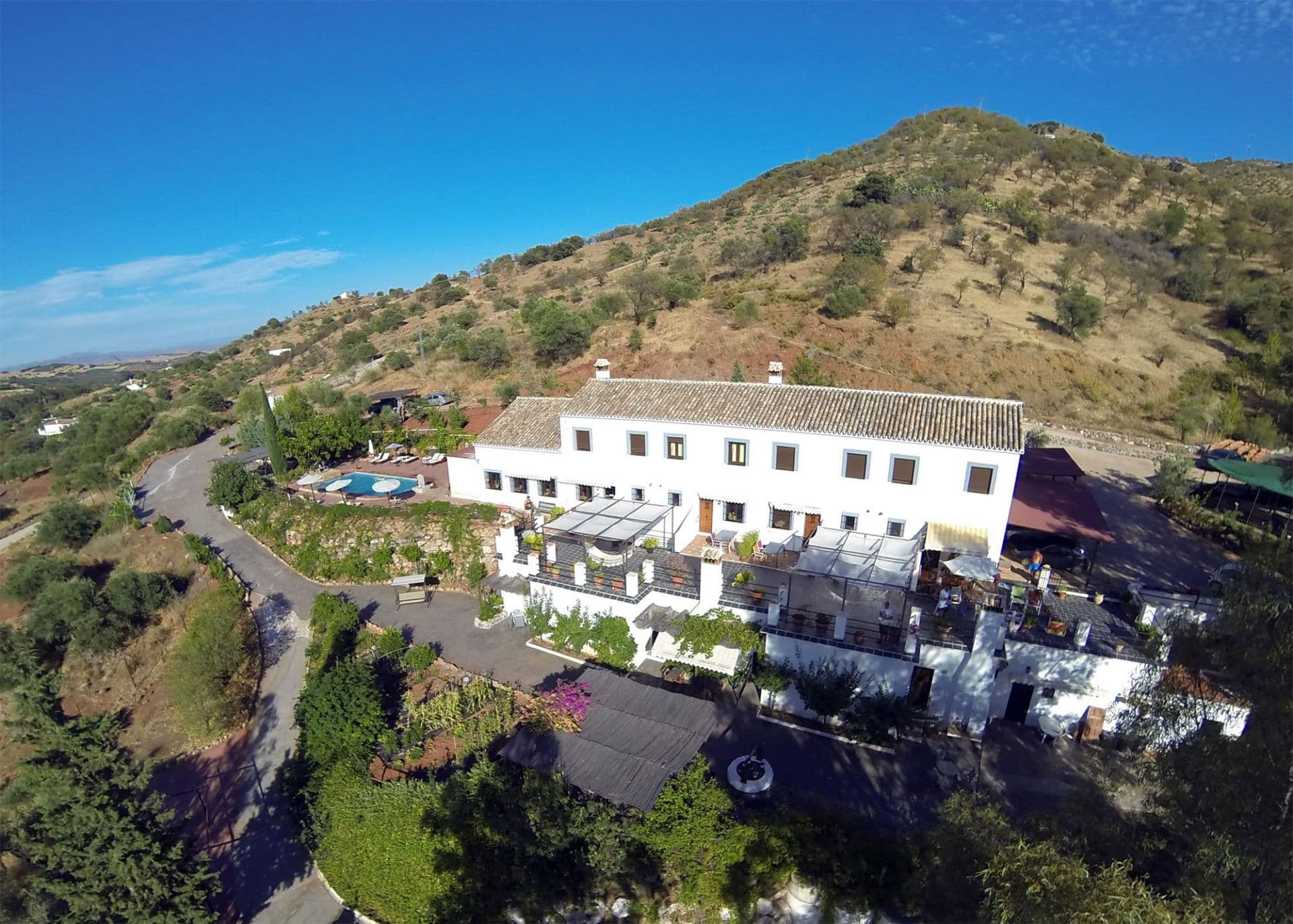 Cosy hotel that forms part of a rural complex in the countryside and comprises of 7 independent houses.This fantastic building has a nice pool, outdoor dining area, barbecue, gardens, a playground and a nice balcony with great views. The Finca is set on an orchard of orange trees in the lower area it borders the river Santa, where you can find the fifteenth-century Mill, which gives its name to this place.It is located at the gates of the Sierra de las Nieves Natural Park, between the towns of Guaro, Alozaina, Tolox and Coín. At 350m above sea level you can enjoy the privileged mountain views. This hotel is only 2km from Guaro, 12km from Coín and 24 km from Marbella.