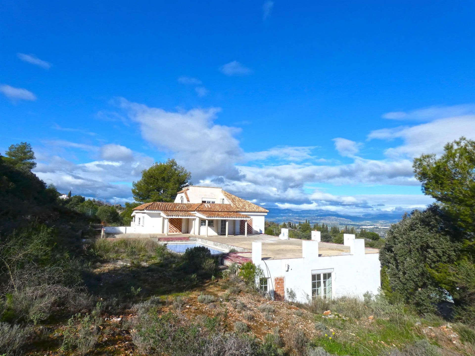 GREAT INVESTMENT OPPORTUNITY! This private villa is about 70% completed and could also be used as a Boutique hotel or bed & breakfast. There are lots of possibilities with a build size of 1.089m². The layout is as follows: Basement (101m²): fitted with windows, wine cellar or gym, guest WC. Ground floor (604m²): 4 bedrooms with ensuite bathrooms, Staff apartment with 2 bedrooms, 1 bathroom, utility room and a separate guest accommodation with 3 bedrooms, 3 bathrooms, kitchen, and living area. First Floor (279m²): Large living room with high ceiling and fireplace, dining room, kitchen and bathroom. Top Floor (101m²): Gallery, with installation prepared for a lift (elevator). Outside is a large terrace and private pool on a plot of almost 4,000m². The property is located at the top of a private, exclusive gated urbanisation, only 5 minutes from the town, giving it a fantastic view of the Guadalhorce Valley and Sierra Nevada. An evaluation was given in 2017 of 1.1 million Euros in its current condition, and 2.2 million Euros when finished. CALL US FOR MORE DETAILS, PHOTOS AND VIDEOS.