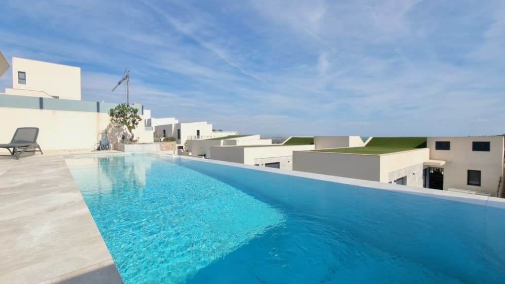 Exclusive detached villa for sale in Rojales, Alicante!This unique villa is located in beautiful Rojales, Alicante. A spacious, green area close to the beautiful sandy beaches of Guardamar del Segura and the Laguna de La Mata nature reserve!Why is this an exclusive property&8364; The property itself has no less than 4 bedrooms and 4 bathrooms and a very large liveable space with a beautiful roof terrace, private pool, bbq and so much more that you must see with your own eyes!This location benefits from easy access to all necessary amenities and is within walking distance of a supermarket and several culinary establishments. The residential complex was realised by a very well-known construction promoter who has many projects to his credit. The choice of durable materials and elegant elements form a beautiful aesthetic whole. The villa itself was customised with great style and taste by the owners.Through the entrance hall, with security door, one enters the very spacious living space followed by an open kitchen with beautiful luxury finishings.The open kitchen is equipped with all contemporary appliances and thus offers all the necessary comfort for its future occupants. In the living area, you will also find a sliding door leading to the private pool, where you can enjoy breakfast under the Spanish sun with magnificent views!Beautiful tiles were used throughout to reflect a uniform whole. In short, a real pearl on the Costa Blanca where the quality of living is central.