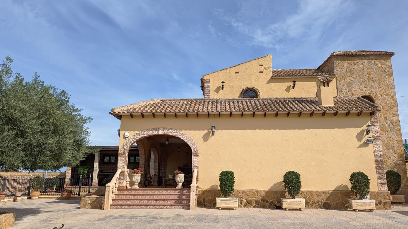 Nestled in the serene town of Bigastro, Alicante, lies this stunning detached villa that's waiting to be called home. This beautiful villa boasts a magnificent plot of 2797m² and a spacious built surface of 429m². The moment you step inside, you'll be greeted by an airy and open living area that's perfect for both relaxation and entertainment.The villa features three comfortable bedrooms that are perfect for a family or for hosting guests. The big kitchen with a laundry room is a chef's dream, with ample space for preparing and cooking delicious meals. The two luxurious bathrooms provide a spa-like retreat for you to unwind and relax.The villa is not only comfortable but also luxurious, with a private swimming pool for your leisure, a wine cellar for your collection, and an outside BBQ area for entertaining guests. The two-car garage and motor court offer convenient parking options for you and your guests.This villa is a true gem, combining the best of both indoor and outdoor living. You'll be impressed by the expansive views of the surrounding greenery and the mountains beyond. This property is an oasis of calm and tranquility, where you can relax and enjoy the peace and quiet of the countryside.If you're looking for a luxurious home that offers privacy, space, and comfort, then this stunning villa is the perfect choice for you. Priced at €499.900, this is a rare opportunity to own a piece of paradise in one of the most desirable locations in Alicante. Don't miss out on the chance to make this dream home a reality.
