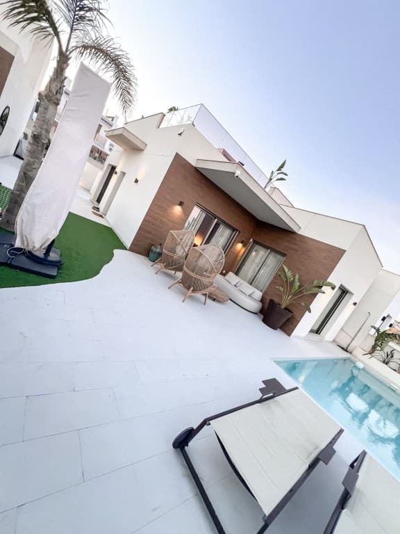 luxury villa in San Miguel De Salinas. This luxurious home boasts no less than 4 bedrooms and 3 bathrooms. The property is south-east facing and enjoys plenty of natural light thanks to the open spaces and large windows.On the ground floor, the villa has a spacious open-plan living and dining area with modern kitchen fully equipped with high-quality materials and appliances, as well as a quooker. There are 3 bedrooms and one en -suite with an en-suite bathroom. The second bathroom is on the same floor with the same high-quality finishes. Underfloor heating is provided in the living room, kitchen and all bathrooms. The villa has all kinds of extras: an alarm system, cameras, air conditioning, fly screens and electric shutters.Downstairs there is one bedroom with en -suite bathroom, which also offers the possibility to make 3 more bedrooms. These rooms are now used as a gym with full professional equipment. A laundry with worktop, a large storage room and a desk.The garden with swimming pool has large terraces where you can place garden furniture for outdoor dining and a barbecue area. The large solarium has a full outdoor kitchen with cold and hot water and a bar where you can enjoy the fantastic views with your friends and family. The villa is equipped with new solar panels, making it an eco-friendly and sustainable option for buyers interested in renewable energy.In short, this modern property in one of the Costa Blanca's most exclusive areas is a unique opportunity not to be missed. It offers a great quality of life and the opportunity to enjoy the best amenities, climate and natural beauty of this part of Spain.Interested buyers should act quickly to ensure they don't miss this opportunity.