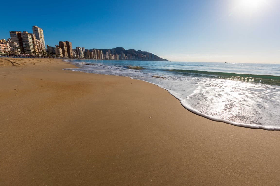 Wake up to the sound of the waves and panoramic sea views in this beautiful beachfront apartment located in the sought-after Playa de Levante area of Benidorm, Alicante.Located in one of the most prestigious buildings in Playa de Levante, this corner apartment boasts three facades and an impressive 180º panoramic view of the Mediterranean.A rare opportunity to own a frontline apartment in the heart of Playa de Levante, Benidorm. Set in an unbeatable location directly on the beach, this spacious 3-bedroom, 3-bathroom apartment offers breathtaking sea views and endless potential for transformation.With a total surface area of 114 m² (86 m² living space), the apartment is in need of some renovation, allowing you to create your dream home by the sea. Built in 1970, the property retains its original layout and features, and would benefit from a modern update throughout—including furniture and finishes.Key Features:Prime first-line location with uninterrupted views of the MediterraneanGenerous interior space with 3 bedrooms, 3 bathrooms, and a large living areaPrivate parking included – a rare find in this areaAccess to a communal swimming poolBuilding with elevator Fully equipped kitchen (appliances included but dated)Located in the vibrant Playa de Levante area, walking distance to shops, restaurants, and nightlifeThis is an ideal opportunity for investors or buyers looking to renovate and add value in one of the Costa Blanca’s most desirable coastal cities. Whether you're looking to renovate for personal use or to generate a high income from holiday rentals, this apartment represents a smart investment in one of the Costa Blanca’s busiest tourist hotspots.Get in touch today to arrange a viewing and explore its full potential.
