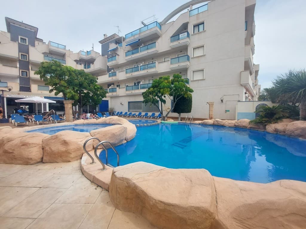Stunning Fully Renovated Apartment in Cabo Roig – A Perfect Blend of Comfort and Investment PotentialThis beautifully renovated 1-bedroom, 1-bathroom apartment, facing southeast, offers a perfect combination of modern living and a fantastic investment opportunity. Situated in the sought-after Aguamarina residence, this property enjoys high rental demand, making it an ideal choice for both personal use and investment.Meticulously maintained, the apartment boasts a brand-new kitchen and bathroom, along with a spacious living/dining area that opens onto a sun-filled terrace. The well-equipped kitchen complements the open-plan living space, while the bedroom features ample fitted wardrobes. The expansive private terrace is perfect for soaking up the sun throughout the day.With a total area of 72m², this apartment also includes private underground parking and easy elevator access. The gated complex offers a beautifully landscaped garden, a large communal swimming pool, and a welcoming reception area.Ideally situated in the heart of Cabo Roig, with vibrant bars, shops, and restaurants just moments away, and only a 3-minute stroll to the pristine sandy beaches, this property offers the perfect coastal lifestyle.