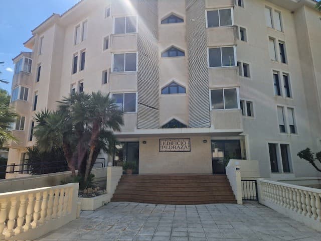 Exclusive Apartment in Albir. Prime Location Bright and spacious apartment of over 100m² located in one of the most sought-after areas of Albir, just a few meters from the beach and surrounded by all amenities, shops, and public transportation.The property has 3 bedrooms (2 of them doubles), 2 full bathrooms, and a separate kitchen with a utility room.It is equipped with individually controlled air conditioning for year-round comfort.From the living room and master bedroom, you have access to a generous open terrace, ideal for enjoying the Mediterranean climate, with pleasant views of the pool, the complex's gardens, and a touch of the sea.Located in a carefully designed complex with a communal pool, green areas, and a peaceful atmosphere.Underground parking included in the price.