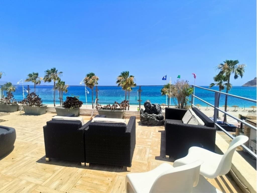 Unique Beachfront Property in Albir. &127754; Unique Beachfront Property in AlbirAn exclusive opportunity to acquire a luxury home located right on the beachfront in one of the most prestigious and picturesque areas of Costa Blanca — Albir.&127969; Key features:- Total built area: approx. 329 m²- Spacious sun terrace: approx. 100 m²- Plot size: approx. 580 m²- Covered parking for 4 cars&127968; Layout:- 3 levels: - Ground floor: Three fully independent apartments, each with its own kitchen, living area, two bathrooms, and built-in wardrobes - Middle floor: Two bedrooms, two bathrooms, a full kitchen, and a large terrace with breathtaking sea views - Top floor: Open panoramic terrace with a chill-out area and stunning views of the sea, mountains, and promenade&128719; Total: 7 bedrooms, 5 bathrooms&127749; Unobstructed, direct views of the sea, beach, and mountains from every level.&127958; True beachfront location — with no road or buildings in front of the house.&128220; Comes with a valid tourist license&128198; 100% year-round occupancy&128176; Consistent high rental income, above average for the area&10024; Perfect for:- Private beachfront living- Investment with excellent ROI- Combined use (personal + rental)&128205; A rare opportunity to own a truly unique coastal property with unbeatable location, flexibility, and income potential.**Don’t miss your chance to secure this exceptional home.**