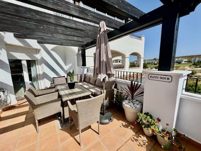 We are delighted to present this highly sought-after 2-bedroom, 1-bathroom L-shaped terrace apartment, offering stunning views over the lake and golf course.The spacious living/dining area with large patio doors that open onto the expansive L-shaped, SOUTH WEST facing terrace. This outdoor space with pagola is perfect for alfresco dining, theres is also uncovered area for sun worshippers.The well-appointed kitchen leads to a generously sized utility room, with all white goods included in the sale for ease of moving in.Both bedrooms are equipped with built-in wardrobes, and the master bedroom boasts direct access to the terrace, making it the ideal retreat.The bathroom is fitted with a bath and overhead shower, sink with vanity unit and mirror, as well as a WC and bidet.For further convenience, there is designated underground parking space, accessible via a remote-control fob with lift access to the second floor.This property is offered furnished, making it an excellent turnkey opportunity for buyers seeking a ready-to-move-in home.