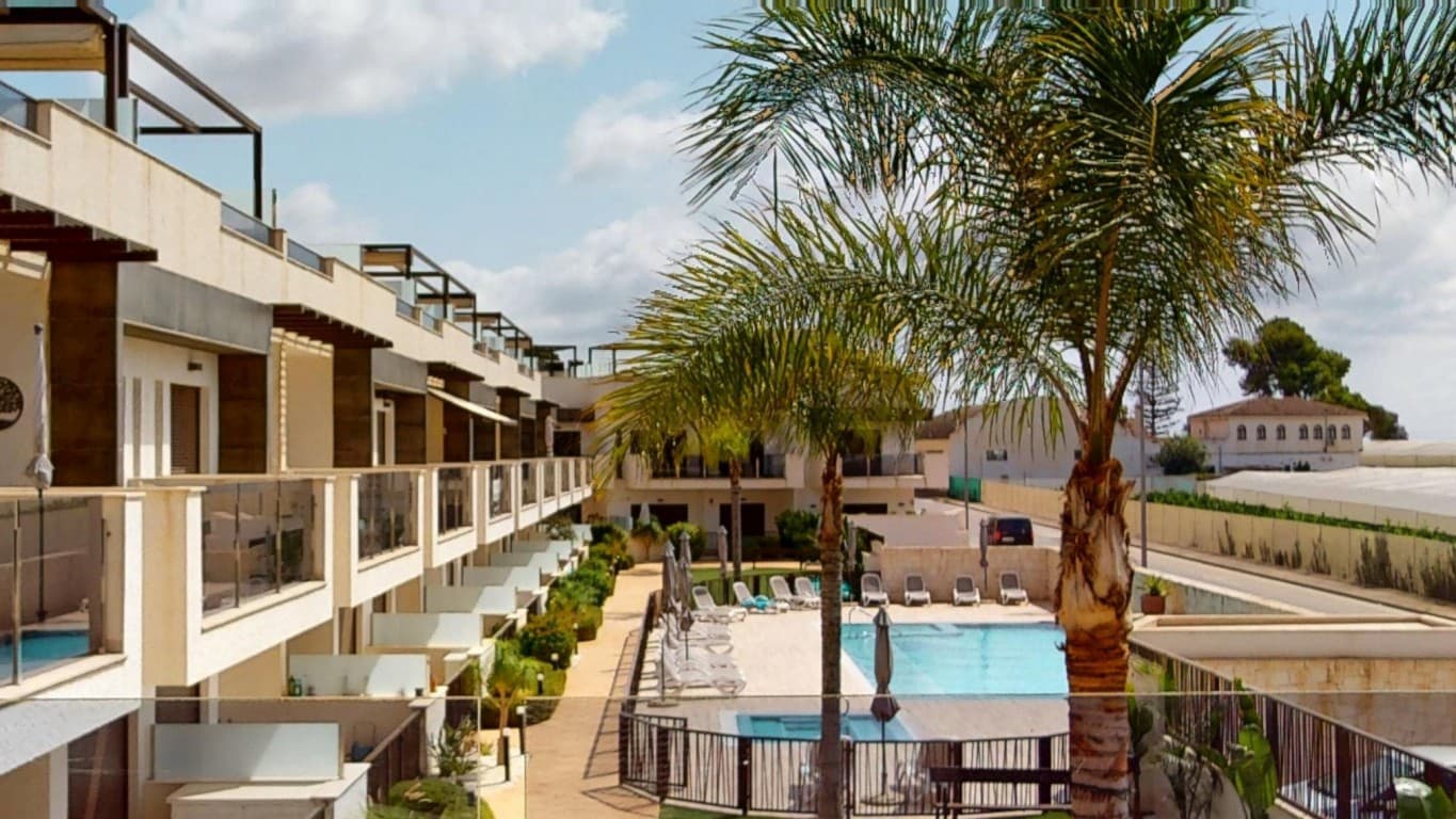 Modern Apartment with Solarium and Pool Views in Dolores de PachecoLooking for a move-in-ready apartment under the sun&8364; Discover this beautiful, modern first-floor apartment in the charming town of Dolores de Pacheco – built in 2019 and in excellent condition!The property features 2 spacious bedrooms and 2 stylish bathrooms, both with walk-in showers. There are built-in wardrobes throughout, and the apartment is sold fully furnished – ready to move in immediately.The open-plan kitchen is fully equipped and flows into the dining and living area, which opens onto a sunny terrace with views over the communal pool. With integrated air conditioning (hot/cold), you’ll enjoy year-round comfort.From the front terrace, a staircase leads to the generous private solarium – the perfect spot to relax or dine under the pergola. There's also an outdoor kitchen and more views of the pool – ideal for warm evenings and relaxed barbecues.Set in a small and peaceful community, the apartment is located less than 1 km from restaurants, shops, and local bars. The beautiful Mar Menor beaches are just 4 km away, perfect for cycling!A unique opportunity for those seeking comfort, tranquility, and the charm of the Spanish coast. Don’t miss out – book your viewing today!