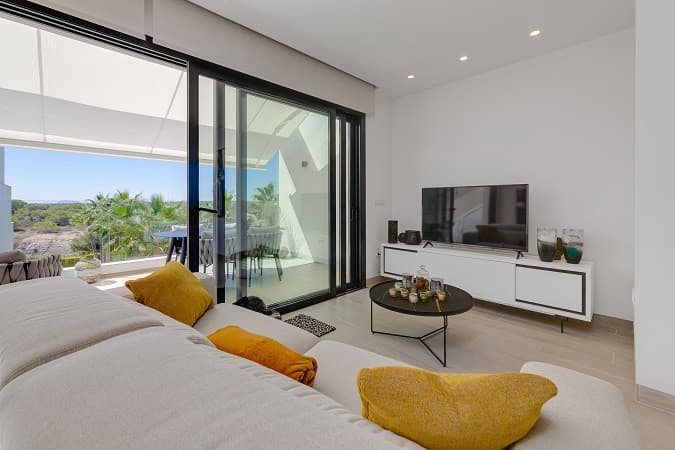 Penthouse with sea views! Las Colinas.. Discover this beautiful apartment on the edge of the exclusive and multi-award-winning Las Colinas Golf Resort. It is completely ready to move into: fully furnished, equipped with high-quality Bosch appliances, kitchenware, stylish decoration and even bed and bath linen.The flat stands out for its modern and elegant design, with the lockable open kitchen as a real eye-catcher – a unique feature that you simply must see. The bright living room is bathed in natural daylight thanks to the floor-to-ceiling sliding doors, which allow the indoors and outdoors to flow seamlessly into one another.The property has two spacious double bedrooms, one of which has an en-suite bathroom and fitted wardrobes. From your bed, you have a beautiful view of the entire resort. All windows are fitted with electric blinds and curtains, so you can adjust the light to your liking.Both bathrooms are in excellent condition, fully equipped and have underfloor heating – ideal during the cooler days of the Spanish winter.On the south-facing terrace of 20 m², you can enjoy the sun all day long and a breathtaking, unobstructed view of the adjacent nature reserve. As there will never be any construction here, this panorama is guaranteed to remain.Additional amenities:• Large private parking space in the underground garage• Two spacious storage rooms• Lift with direct access to the front door• Communal swimming pool• Access to the exclusive WOW Beach Club by Las Colinas in Dehesa de CampoamorLiving in Las Colinas Golf Resort means enjoying luxurious facilities: a stylish clubhouse with panoramic views over the golf course, a wellness centre, tennis courts and three restaurants serving both international and local cuisine.Whether you are looking for a permanent home, a profitable investment or a sunny holiday retreat, this flat offers a unique blend of comfort, luxury and exclusivity in one of Spain's most sought-after residences.