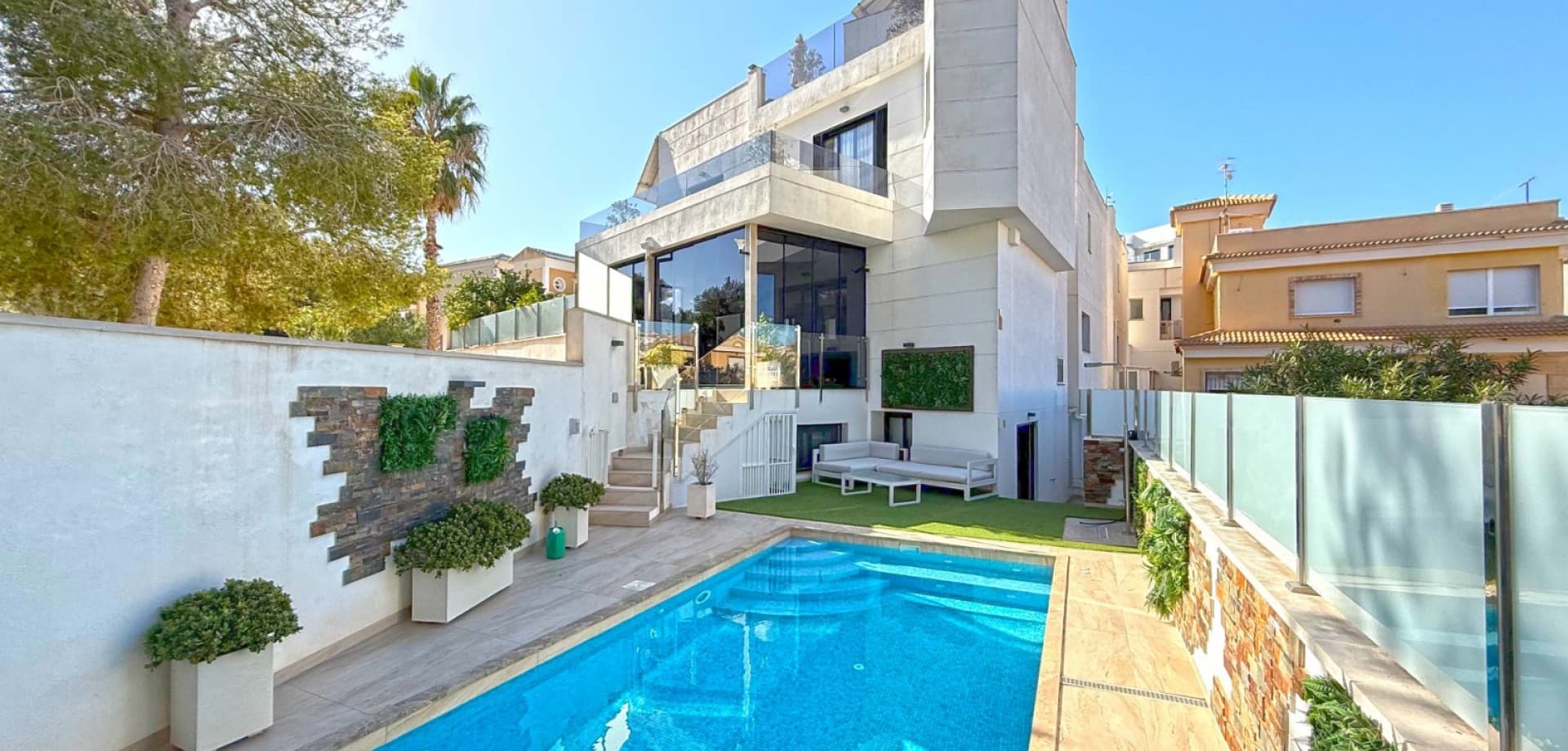 This stunning corner villa, nestled at the end of a peaceful cul-de-sac in the sought-after area of Villamartin, offers the perfect blend of luxury and modern living. With 3-4 spacious bedrooms and 3 bathrooms (2 of which are en suite), this home provides ample space for family living and guests. The open-plan living area is designed for modern comfort, featuring a sleek, contemporary kitchen and a bright, airy living room that flows seamlessly into the private conservatory, ideal for year-round relaxation.

The villa boasts a private, heated pool, perfect for enjoying the sunny Mediterranean climate in ultimate privacy. For those seeking wellness and relaxation, the property includes a sauna and underfloor heating throughout, ensuring comfort in every season.

Additional features include a convenient WC, a spacious basement offering endless possibilities for storage or additional living space, and off-street parking. The luxurious finishings and attention to detail throughout the villa elevate it to a standard of modern elegance, making it an exceptional residence in one of Villamartin's most desirable locations.