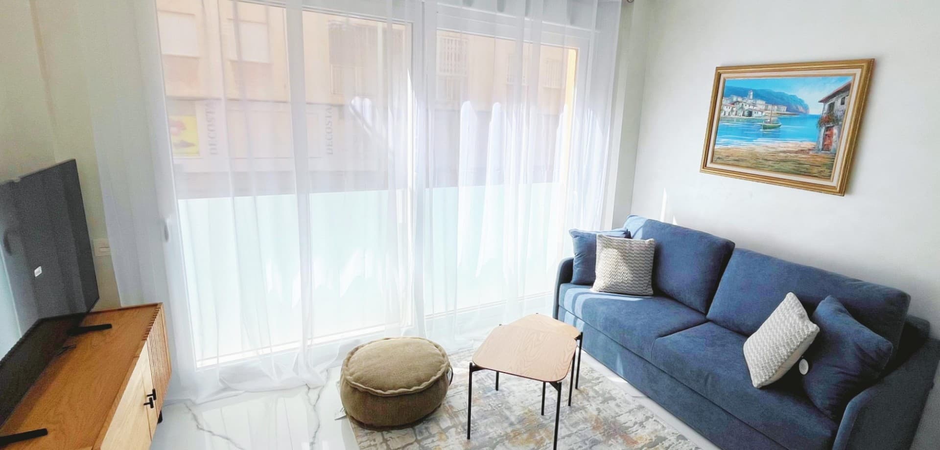 Located in the prime beachfront area of Avenida de la Purísima, just steps from Playa del Cura, this stylish ground floor apartment offers the perfect balance of coastal lifestyle and modern elegance.

With 90 m² of built space, the home features 2 spacious bedrooms, 2 luxurious bathrooms, and a beautifully designed private patio—making it ideal as a permanent residence, a premium holiday home, or an attractive rental investment.

Inside, the apartment boasts a bright open-plan living and dining area, floor-to-ceiling windows, and sleek interior finishes. The contemporary kitchen is fitted with top-quality appliances, matte black countertops, and elegant cabinetry.

Both bedrooms are tastefully furnished with designer wardrobes and plush bedding, while the master suite opens directly to a private patio featuring an outdoor shower, artificial grass wall, and wood accents—a peaceful space to unwind after a day at the beach.

The two bathrooms are finished with high-end ceramic and marble-look tiles, LED-lit mirrors, and walk-in glass showers for a touch of hotel-style comfort.

Key Features:





2 bedrooms and 2 bathrooms





Private internal patio with outdoor shower





Fully furnished and move-in ready





BOSCH kitchen appliances





Elegant white marble-effect floors





LED mirrors and designer finishes





Fitted wardrobes and extra storage





East-facing with natural light throughout





Heating and air conditioning





Accessible entrance for reduced mobility





Surrounded by shops, restaurants, and 24h pharmacy





Just 100 meters from the sea





This is a rare opportunity to own a fully renovated, turnkey apartment in one of Torrevieja’s most sought-after locations, combining modern comfort, unbeatable convenience, and timeless style.

Book your private viewing now!