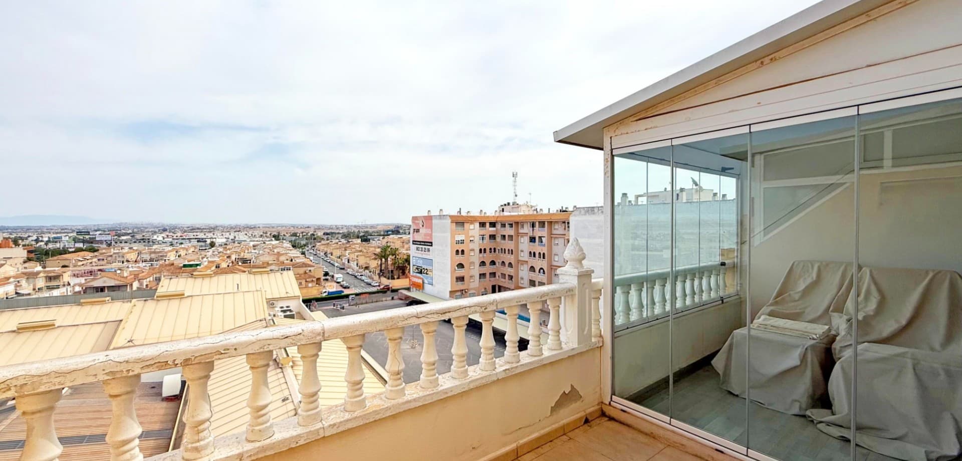 Discover this 5th-floor penthouse apartment in the heart of Torrevieja, ideally located just a short walk from shops, restaurants, and the vibrant promenade. This bright and airy property offers 2 bedrooms, 1 bathroom, and a spacious living area with air conditioning for year-round comfort. There is also a community rooftop.

The standout feature is the large, partly glazed-in terrace—perfect for enjoying meals or relaxing while taking in the spectacular panoramic views of the city and the famous pink salt lake.

Sold furnished and ready to move in, the apartment also benefits from access to a well-maintained communal pool—an ideal option for both permanent living and holidays.

Don't miss this rare opportunity for a top-floor home with unbeatable views and central location!