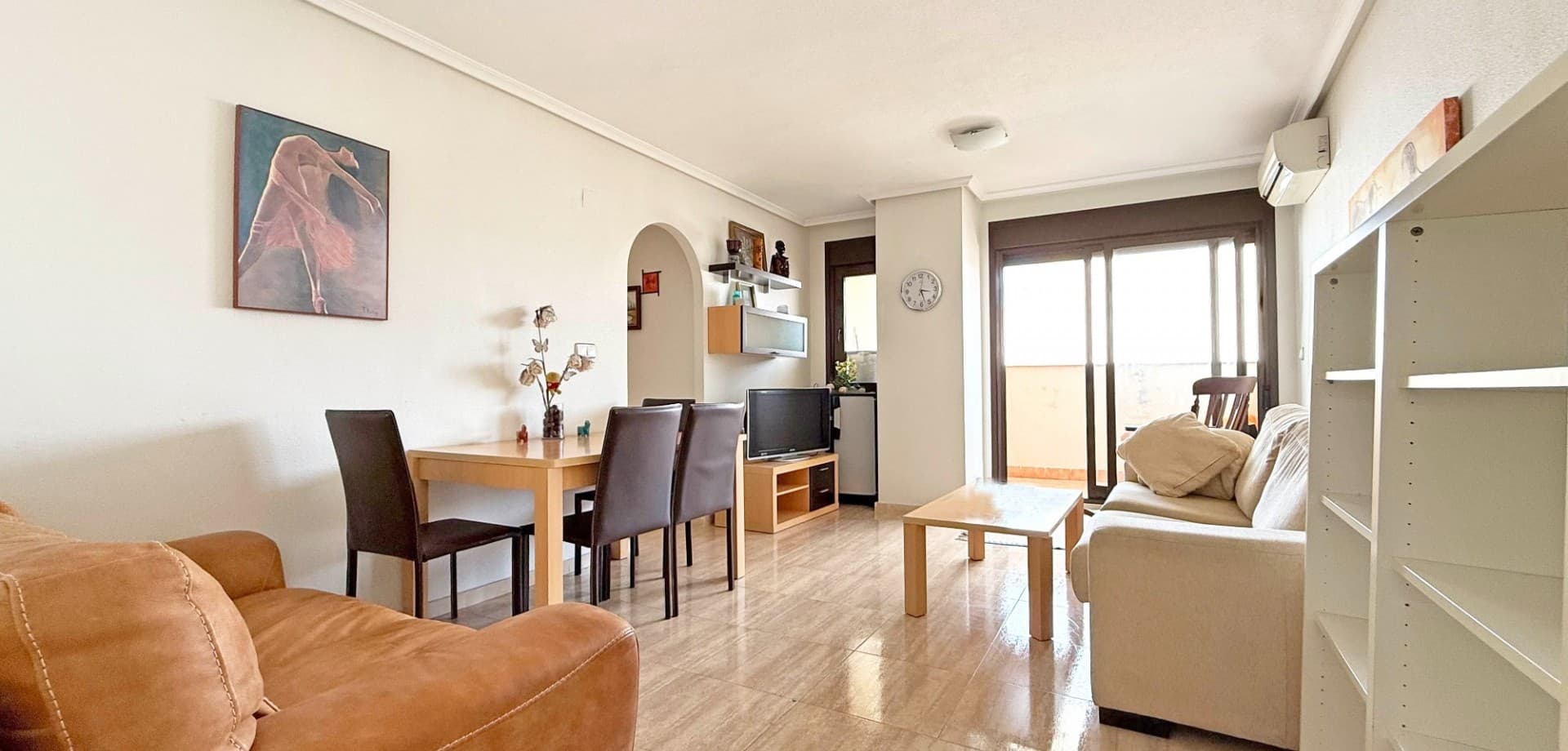 Welcome to this bright and spacious 4th floor apartment located in the heart of Torrevieja, just a short stroll from the promenade, shops, and all local amenities.

This east-facing apartment offers 3 bedrooms, 2 bathrooms, and a generous balcony with views of the communal pool – the perfect place to enjoy your morning coffee in the sun. The open-plan living and dining area is equipped with air conditioning and comes fully furnished, ready for immediate use.

Located in a well-maintained building with lift access and a large communal pool, this apartment is ideal as a holiday home, permanent residence, or rental investment in one of Costa Blanca’s most vibrant coastal towns.