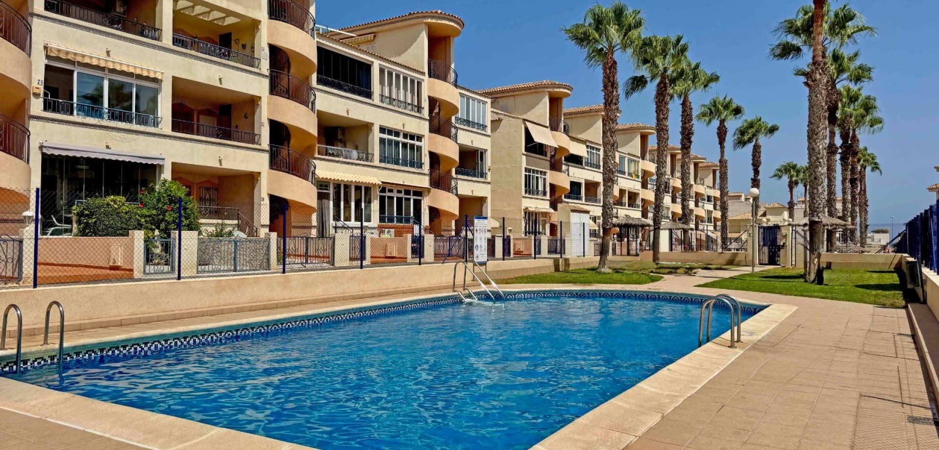 Situated in the sought-after area of Los Altos, Orihuela Costa, this first-floor corner apartment offers all-day sun, tranquil views over green areas, and access to two well-maintained communal pools.

The property boasts approximately 72 m² of living space, including a 12 m² glazed terrace—perfect for relaxing or dining in comfort year-round.

Inside, the apartment features 2 bedrooms, 1 bathroom, and a bright, open-plan layout with tasteful designer furnishings and modern finishes throughout.

Included in the sale:





Air conditioning





Smart TV





Dishwasher





Washing machine





Fridge





Brand-new mattresses





Designer furniture





Ambient LED lighting





Built-in wardrobes and mirrors





Located within a pet-friendly community with a dedicated dog park nearby, this home is just a short walk from supermarkets, cafés, and restaurants, offering both convenience and a relaxed lifestyle.

This is a move-in-ready property ideal as a holiday home, rental investment, or permanent residence.

Contact us today to schedule your private viewing.