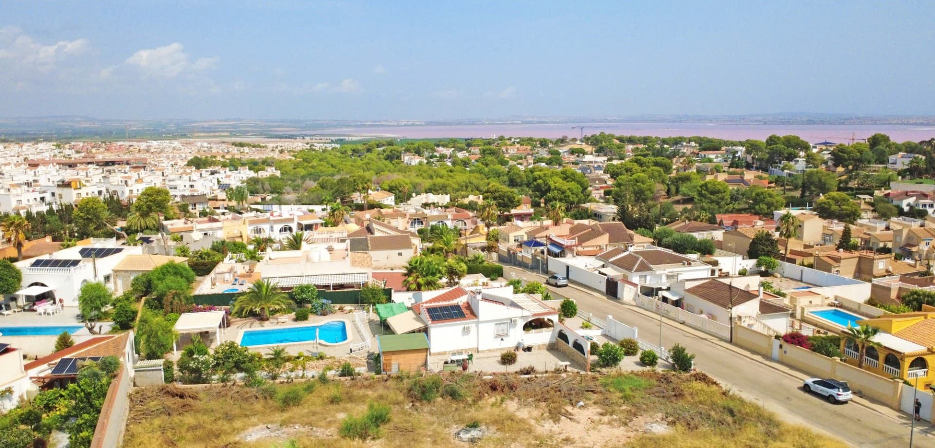 We are proud to present this exceptional 970 m² building plot, located in the highly sought-after residential area of Los Balcones, Torrevieja. Set within a quiet, established neighborhood, this plot offers the perfect balance of peace, privacy, and proximity to all essential services, including supermarkets, restaurants, schools, and medical facilities.With building permits already in place, the plot allows for the construction of up to 503 m², including a spacious 140 m² basement and garage. This gives you the freedom to create a bespoke villa that perfectly suits your lifestyle, whether you’re envisioning a modern family home, a luxurious holiday retreat, or a high-value investment property.One of the standout features is the potential for panoramic views of the famous pink salt lake, offering a truly unique and picturesque backdrop from your future home.Key FeaturesPlot size: 970 m²Buildable area: 503 m² (including basement & garage of 140 m²)Permits included – ready to start buildingLocated in a quiet, established residential neighborhoodClose to all services: shops, restaurants, schools, hospitalPotential for lake viewsThis is a rare opportunity to secure a prime plot with excellent potential in one of the most desirable areas of Torrevieja.