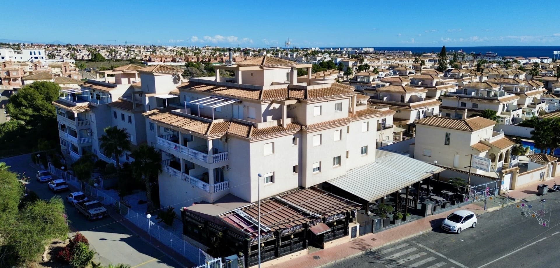 Introducing a charming apartment located on Calle Nicolás de Bussi, Playa Flamenca — an ideal home for holidays, rental investment, or full-time living on the Costa Blanca.This well-maintained property offers 2 spacious bedrooms with double built-in wardrobes, a large bathroom with shower/WC, and a separate laundry/storage room providing excellent extra space.The kitchen features modern appliances from 2021, and the home is equipped with air conditioning in the living room and both bedrooms, plus ceiling fan/light in the kitchen and dining area.The large terrace offers plenty of outdoor space.Located on the 3rd floor (no lift), the apartment enjoys a central position within walking distance to supermarkets, restaurants, shops, go-karting, a water park and La Zenia Boulevard (6 minutes). The beaches of Playa Flamenca are just 13 minutes away, and Alicante Airport is 40 minutes by car.A private garage space is included in the price.The residential complex also offers a community pool.