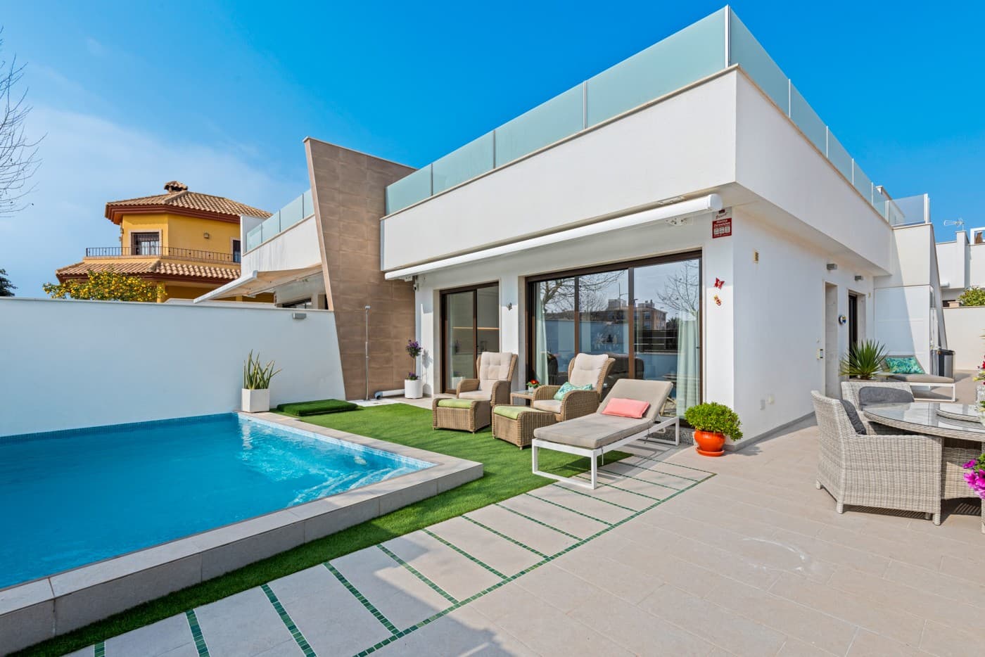 Dreaming of a modern home with a private pool, close to both the town center and the beach? This stunning semi-detached villa, built in 2019, boasts a perfect south-facing location in the popular area of Pilar de la Horadada, within walking distance of the town center and just a short drive to the beautiful Las Higuericas beach.

The property features 3 bedrooms and 2 bathrooms, both equipped with underfloor heating, as well as a bright and spacious living room with an open-plan kitchen.

One of the home’s standout features is the impressive rooftop terrace of 100 m² – ideal for sunbathing, social gatherings, or simply enjoying the view. The terrace is equipped with a shower, pre-installation for a jacuzzi, an outdoor kitchen, a pergola for shade, and a storage room. Outside, you’ll find a private heated pool of 3,5x5,5m, allowing year-round use. Additionally, there is plenty of outdoor space on the ground level.

The property is sold furnished, so you can move straight in and enjoy your new life in sunny Spain!

Pilar de la Horadada is a charming coastal town in the province of Alicante. Located on the southern Costa Blanca, it boasts beautiful sandy beaches, a Mediterranean climate, and a rich historical heritage. The town offers a mix of modern amenities and traditional Spanish culture, with lively markets, local festivals, and a picturesque old town. Its proximity to the Mar Menor and natural parks makes it a great destination for outdoor activities like hiking, cycling, and water sports. Whether you're looking for relaxation or adventure, Pilar de la Horadada is a perfect getaway.

Contact us for more information or to arrange a viewing.