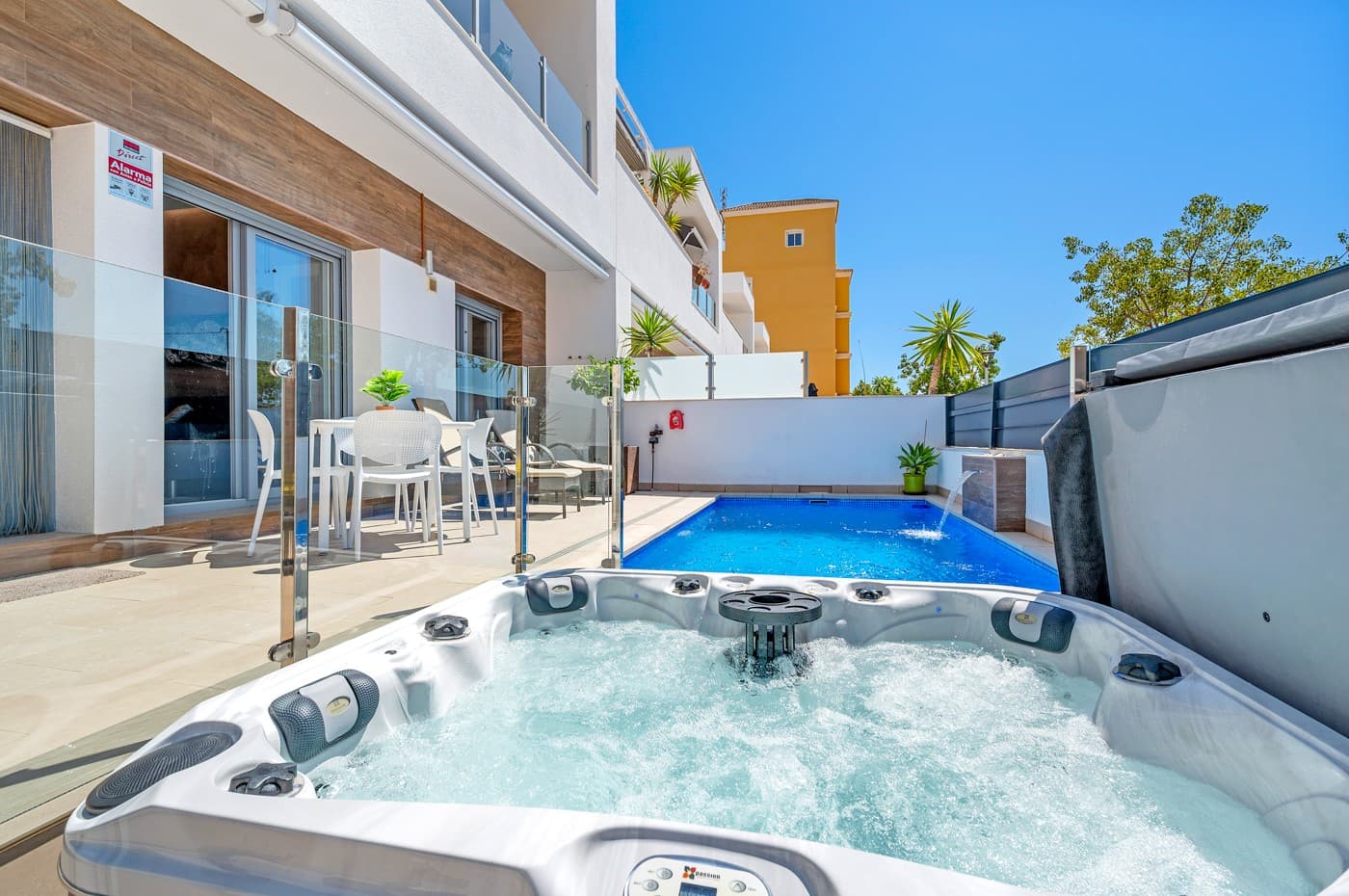 Located in the heart of the charming and authentic Spanish village of Formentera del Segura, this beautifully maintained townhouse offers a unique combination of modern comfort and traditional atmosphere. Built in 2018, the home is part of a small and exclusive community of only four properties. All current neighbours have owned their homes since the development was completed. This is the very first time one of these properties is being offered for sale, making it a rare and valuable opportunity.

The property features three spacious bedrooms and two stylish bathrooms, one of which is en-suite. Two of the bedrooms are conveniently located on the ground floor, making the home practical and easy to live in year-round. The interior is tastefully decorated with high-quality furniture and finishes, all of which are included in the sale. The house has been meticulously cared for and is in excellent condition, offering a true turn-key solution.

Outside, you are welcomed by a private swimming pool with a beautiful waterfall feature, as well as a private jacuzzi – the perfect spot for relaxation and enjoyment. The rooftop terrace offers wonderful potential: it has already been prepared for the extension of the third bedroom with one more private bathroom, with both drainage and electrical installations prepared. The terrace is ideal for entertaining or simply enjoying the Mediterranean lifestyle, complete with built-in sunshades, privacy screens, and a sheltered lounge area. The views from here are truly amazing!

The home is equipped with a full-house water filtration system, allowing you to drink directly from the tap. There is air conditioning on both levels – a central system downstairs and a separate unit upstairs – as well as ventilation that has ensured no moisture issues, even when the house has been unoccupied for a long time. Fibre internet is installed and reinforced to provide strong coverage even on the rooftop terrace, making it suitable for working remotely or streaming under the sun also from the rooftop terrace!

This lovely home is sold fully furnished. 

Formentera del Segura offers a welcoming, international community while maintaining its traditional Spanish soul. You’ll find local cafés, bakeries, and restaurants just a short walk away, nearest supermarket is just a two minutes walk! The Norwegian school is an 8-minute drive away. And the golden beaches of Guardamar del Segura only ten minutes by car. Several excellent golf courses are nearby, along with scenic cycling routes and natural parks. This is a truly special home in an exceptional location – perfect for those seeking comfort, style, and a peaceful way of life on the Costa Blanca.