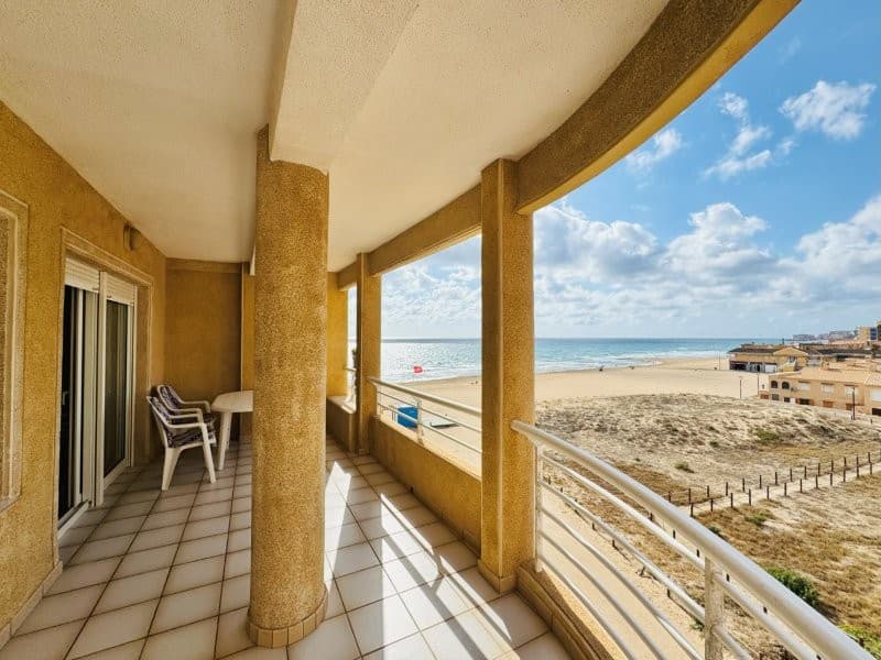 This home is located in the best building in La Mata. It's located on the beachfront, south-facing, and has a spectacular terrace with sea views.It has a constructed area of 123 m2, comprising 4 bedrooms, 2 full bathrooms, a living-dining room, and a separate kitchen with a utility room.The home is in perfect condition and has been very well maintained by the owners.Built-in wardrobes in all bedrooms.Large entrances and porches with two elevators.Very spacious parking space, could fit 2 small cars or a large car and a motorcycle.FurnishedGarage spaceCommunity fees: €400 per yearProperty tax: €376