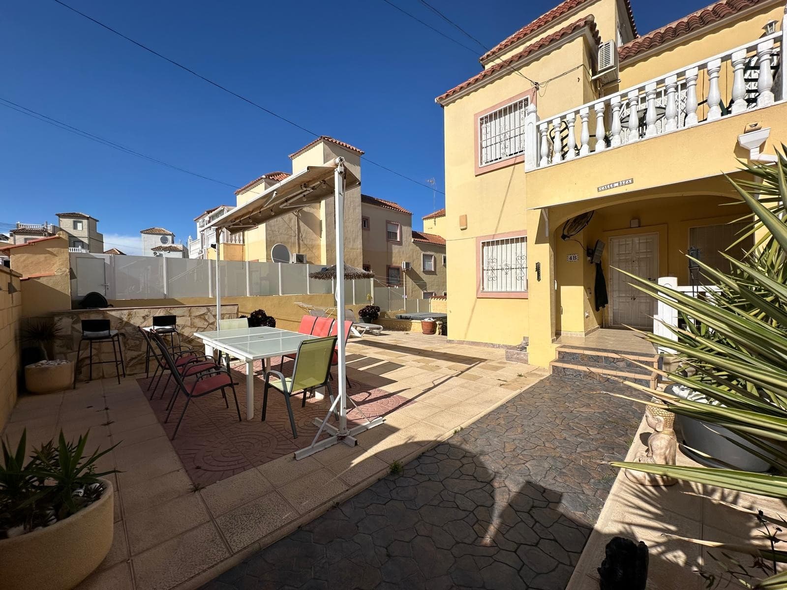 This property is located in El Galan and sits on a spacious corner plot with plenty of outdoor space. The exterior features tiled floors, a lovely dining area, a barbecue area, and a jacuzzi—perfect for enjoying long summer nights in complete privacy.

Upon entry, you are welcomed by a charming enclosed terrace that leads into a spacious open-plan living room. This level includes one bedroom, a family bathroom with a shower, and a fully fitted, newly renovated separate kitchen. There is also access to a closed-in utility area with space for a washing machine.

Additionally, you have access to the under-build of the property, which offers a fantastic bonus space. Downstairs, you’ll find another open-plan living area, three bedrooms with walk-in wardrobe space, a bathroom with a shower, and a separate kitchen room. This level provides ample storage and features double patio doors leading out to the garden area.

With so much space and versatility, this property could easily serve as a perfect family home or even a self-contained apartment on the lower level.