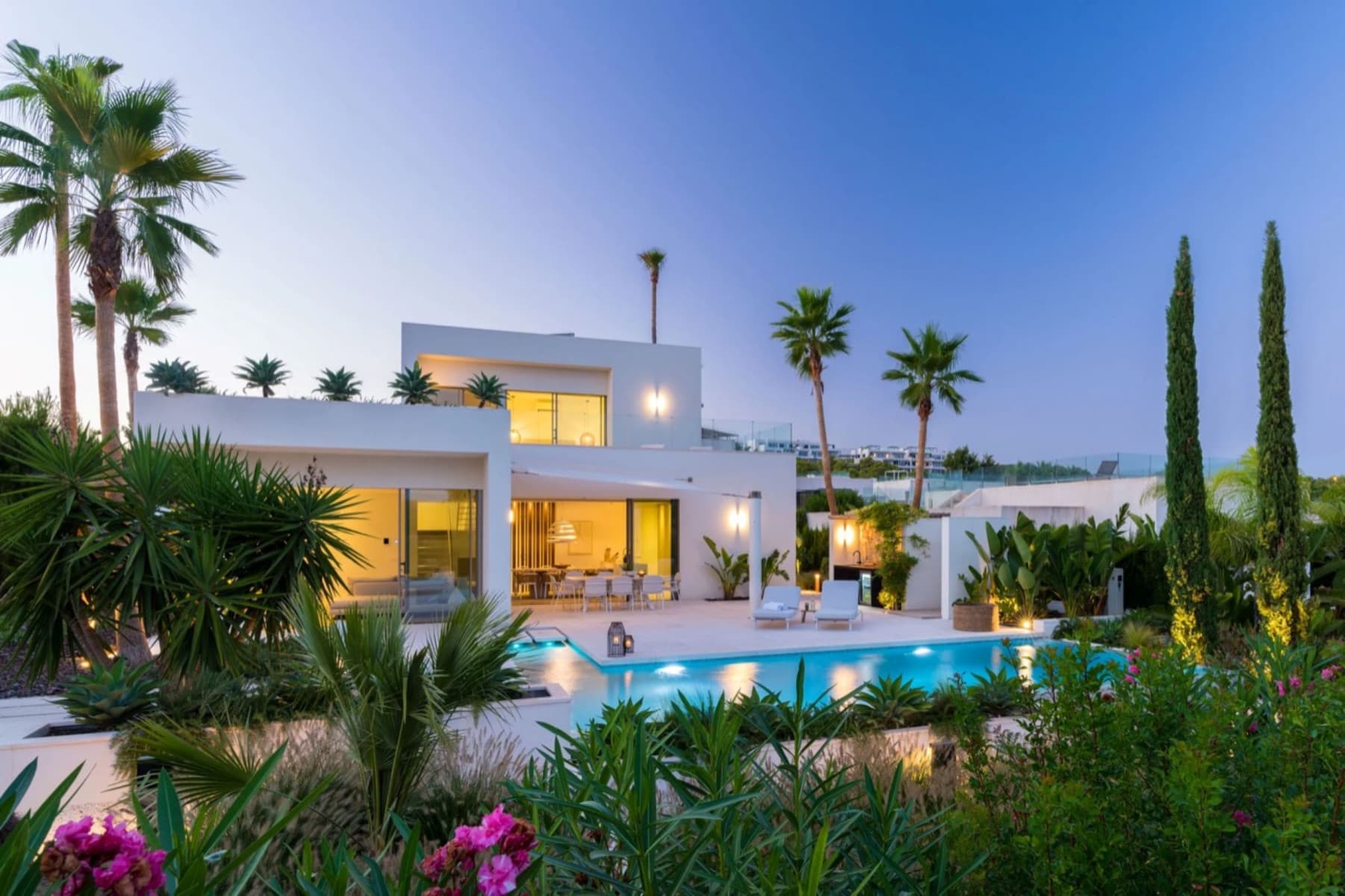 This exquisite villa is located in one of the most beautiful, 

front-line settings in Las Colinas Golf Resort, one of Europe’s finest 

5-star Golf & Country Clubs. A beautiful quiet and dominant location

 with plenty of privacy and stunning views over the golf course and out 

on to the sea. 

With five luxury bedrooms and three family bathrooms, in modern 

design, villa offers ample space for the whole family. Three spacious 

bedrooms are on the ground floor level, the fourth bedroom is on the 

lower level of the villa and the master bedroom with spacious en-suite 

bathroom is on the top floor. 

The master bedroom opens onto a large balcony with comfortable sun 

loungers and beautiful views over the golf course with the Mediterranean

 Sea views beyond. Here you can enjoy your first cup of coffee in the 

morning sun or just admire the beautiful sunset.Upon entering the villa,

 you will immediately notice that this is a very light and spacious home

 of high quality. 

High level ceilings, large windows and beautiful open spaces, 

finished in befitting luxury quality materials with a light color 

scheme, give the house a chic timeless and warm look & feel. The 

spacious living room, dining room and luxurious open kitchen with 

cooking island blend seamlessly. The kitchen is fully equipped with top 

quality Miele appliances, a wine cooler, a quooker tap for instant 

boiling and sparkling water and much more. 

Large sliding doors give direct access to the terrace. Here you will 

find also a luxury outdoor kitchen including an XL Green Egg BBQ. A 

canopy provides the necessary shade. To cool down and relax, beautiful 

Infinity and spacious swimming pool (11 x 5 m) and the outdoor shower is

 adjacent. The pool can be heated, allowing you to swim your laps in 

comfort most of the year. 

A lot of meticulous attention has also been paid to the garden 

landscape, which is a beautiful oasis full of mature Mediterranean 

plants and high palm trees and several terraces and lounge areas. The 

outdoor lighting also creates an intimate, fairy-tale atmosphere at 

night. 

The garden is fully fenced and closed with an automatic gate, there 

is private parking for two vehicles.The villa is equipped with every 

comfort including air conditioning, electric awnings, extensive home 

automation/ domotica, central heating, satellite TV, a Sonos sound 

system, security system and much more. Moreover, the villa is being sold

 inclusive of the complete luxury indoor and outdoor furniture, the 

entire inventory and decoration. The villa is key ready, so just unpack 

your suitcase and immediately start enjoying this beautiful place under 

the Spanish sun.