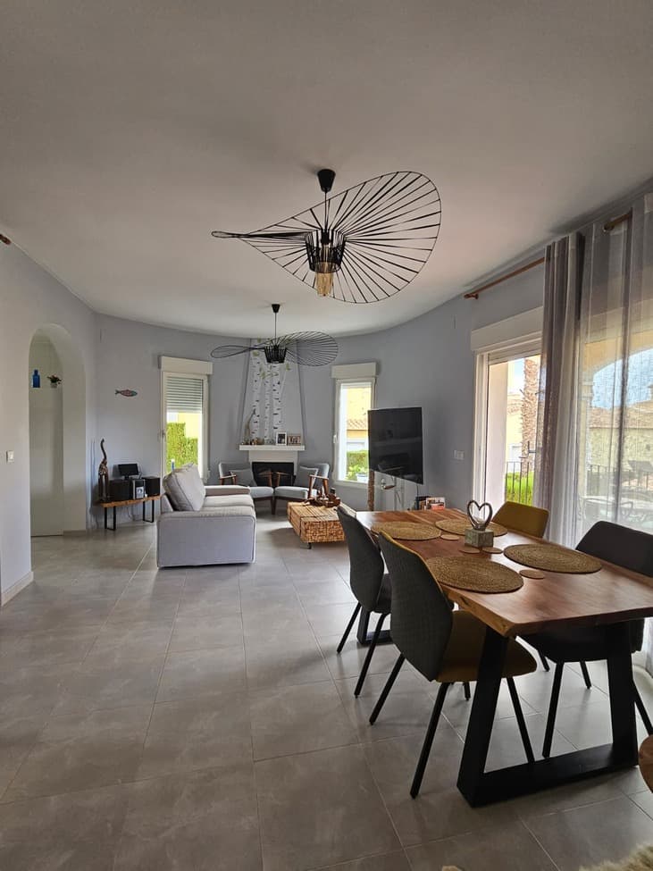 At the heart of the stunning La Sella in Dénia, this charming villa is a perfect retreat for those seeking peace, comfort, and a touch of luxury. The property boasts three spacious bedrooms and two fully equipped bathrooms, making it an excellent choice for both permanent living and a sun-soaked second home.The living spaces are bright and inviting, with direct access to a captivating landscaped garden and a delightful terrace to enjoy at any time of day. The low-maintenance stamped concrete driveway leads to a home finished to perfection, complete with solar panels and a water softener for a stylish and sustainable lifestyle.The basement is furnished and provides ample storage space, further enhancing the property's practicality. Just a short stroll from the main entrance is the community swimming pool, a true asset for those who cherish relaxation and socializing in a picturesque setting.This villa harmoniously blends Mediterranean charm with modern conveniences, nestled in an exclusive location within La Sella.