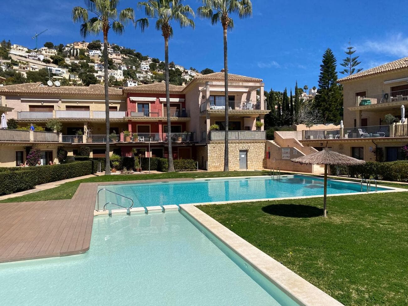 Beautiful Duplex Apartment for Sale in Benissa / MorairaDiscover this stunning first-floor duplex apartment, ideally located in the picturesque town of Benissa, just a short distance from the charming beaches of Moraira and all the local attractions, restaurants, and amenities.With a total area of 109 m², the apartment features a modern open-plan kitchen seamlessly connected to a bright and sunny living room, which opens onto a spacious terrace overlooking the pool—perfect for relaxing or entertaining guests.The lower level includes:Two double bedrooms, one of which boasts an en-suite bathroom with a walk-in shower and a walk-in wardrobe with built-in wardrobes.A guest toilet for added convenience.Upstairs, you'll find a large master bedroom with its own private terrace and a cozy workspace, ideal for remote working or creative pursuits.The apartment has been recently refreshed, with freshly painted walls throughout, giving the interior a clean, modern feel.The property is set within a charming, well-maintained urbanization offering exceptional amenities, including:Three outdoor swimming poolsLush, landscaped gardensAn indoor heated poolJacuzzi and saunaThis is a monitored urbanisation and garage and storage room includedThis serene environment makes it an ideal retreat for year-round living or a holiday home. The nearest beach is only 1.5 km away, allowing you to enjoy the Mediterranean lifestyle to the fullest.Don’t miss the opportunity to own a piece of paradise in one of the Costa Blanca's most sought-after locations. 