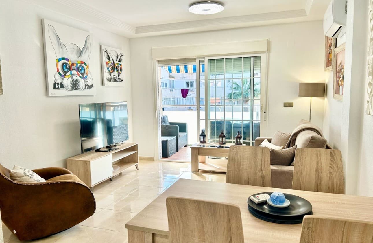 Located just 1.3 km from the seafront, this beautifully presented apartment offers a perfect blend of comfort and convenience—ideal for both permanent living or as a holiday home.This bright and stylish property features:2 spacious bedrooms with fitted wardrobes1 modern shower room and an additional separate W/CA generous lounge with dining area and open-plan kitchenA sunny private balcony, perfect for relaxingEnjoy fantastic communal amenities, including:A rooftop solarium with panoramic viewsA rooftop swimming poolPrivate garage parkingThe apartment is offered fully furnished to a high standard, with all new appliances included.Situated within walking distance to shops, bars, and restaurants, and just a short drive to local shopping centres and a water park.Move-in ready and in immaculate condition—don't miss this fantastic opportunity!