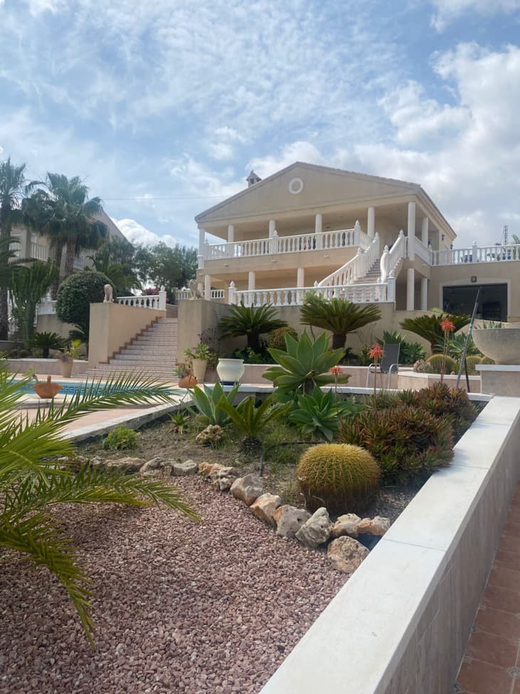 Charming 5-Bedroom Villa with Private Pool & Stunning ViewsThis spacious villa of 220 sqm, built in 2001, offers versatile living across two levels — perfect for extended families, guests, or rental income.Main Residence (First Floor)   •   Generous living room with log fireplace, air conditioning, and underfloor heating throughout the main house   •   Fully equipped kitchen with dining area and patio doors leading to the outdoor space   •   Expansive terraces offering breathtaking views   •   One bedroom with fitted wardrobes and air conditioning   •   Large family bathroomSelf-Contained Apartment (Ground Floor)   •   Two bedrooms with fitted wardrobes   •   Bright living room with air conditioning   •   Fully fitted kitchen   •   Modern bathroom with shower  Outdoor Features   •   Beautiful 10x4m private swimming pool   •   Two garages with motorized doors   •   Landscaped surroundings with plenty of space to enjoy the sunshine and amazing viewsThis villa combines comfort, flexibility, and privacy — ideal as a full-time residence, holiday home, or investment opportunity 
