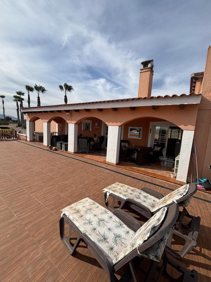 Stunning Country Villa with Breathtaking Mountain Views & Private PoolThis beautiful and spacious villa offers exceptional countryside living, featuring three double bedrooms (with potential to create a fourth), vaulted ceilings, and a modern kitchen complete with exposed beams and a stylish central island. The home enjoys a dual-aspect layout, flooding the interior with natural light and offering magnificent mountain and pool views.Fully equipped for comfort and efficiency, the property includes air conditioning  xxx , solar energy with lithium battery storage, and an xx Electric Vehicle  xx charging point powered by the system. Mains water is also connected.The main bedroom suite features patio doors leading directly to the naya  ? and pool area, a huge walk-in wardrobe, and a luxurious ensuite bathroom with a bath and overhead shower. The villa’s bright and airy living spaces include a large lounge with patio doors opening onto the rear terrace xx decking  Xx —perfect for enjoying the xx sunsets xx and stunning mountain backdrop.Additional features include a spacious utility/food prep room and a converted garage, currently used as a living room and small office but easily adaptable as a fourth bedroom.Outside, the covered naya ? opens onto a raised pool area with ample sunbathing space, all surrounded by fenced land and open farmland views. The property also benefits from a roof solarium offering 360° panoramic views of the surrounding countryside.The land is fully enclosed and comes complete with a tractor xx ride on lawnmower xx , ideal for those wishing to cultivate the land, keep horses, or even explore opportunities such as a motorhome park.This is a truly versatile property offering space, sustainability, and spectacular scenery — perfect for those seeking peace, privacy, and potential in the heart of nature. 