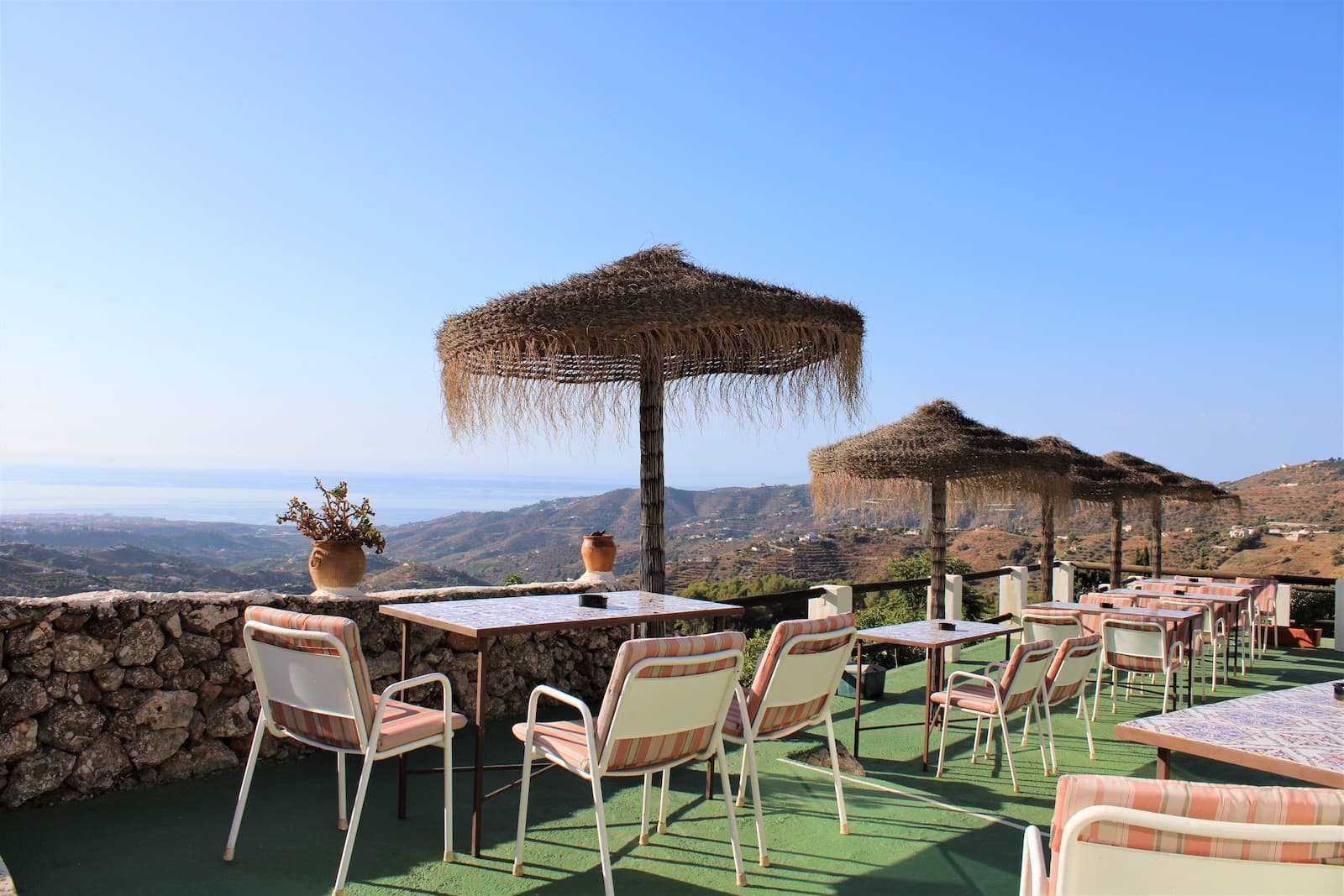 Stunning Property Offer: Price Reduced from €1,049,000 to €950,000Discover this exceptional villa with a renowned restaurant and breathtaking sea views in Frigiliana. This well-maintained property presents an outstanding investment opportunity with significant development potential. Property Highlights:Villa:Size: Approximately 75 sqmLayout: Two bedrooms (one en-suite), an additional bathroom, a cozy living room, and an open-plan kitchenetteFeatures: Decorative ceilings, underfloor heating throughout, and a spacious terrace with stunning sea and mountain viewsRenowned Restaurant:Operation: In business for 35 years.Ambiance: Beautifully decorated in traditional Andalusian style with wooden furnishings and large windows offering scenic viewsFacilities: Fully equipped, bright kitchen, large basement storage, ample indoor and outdoor seating on a south and east-facing terraceView: 360-degree panoramic views of the Mediterranean and surrounding mountainsStudio Apartment:Size: Approximately 50 sqmLayout: Open plan with kitchen, living area, and a large bathroom with a showerSuitability: Ideal for rental, with a separate entranceAdditional Plot:Size: 10,700 sqmFeatures: Olive and citrus trees, terraced layout for easy maintenance, a 40 sqm building with water and electricityPotential: Ample space for personal cultivation or further developmentUtilities and Parking:Water Supply: Community water system with a 9,500-liter deposit and water purifier installedParking: Plenty of parking space, including a lockable garageInvestment Potential:This property offers the flexibility to convert into a larger rural residence, create three independent homes, or continue operating the esteemed restaurant. It's perfect for a family or a business looking to invest and capitalize on this incredible estate.Contact us for more information, additional pictures, and videos. Don't miss this rare opportunity to own a unique and versatile property in a prime location.