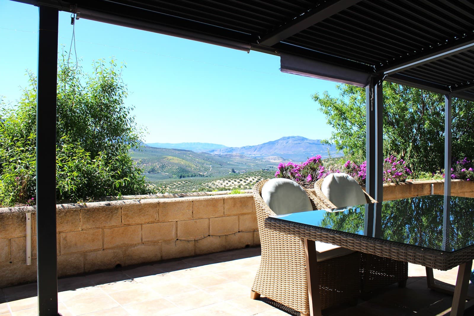 Well maintained traditional Andalusian Cortijo on two levels, surrounded by 400 producing olive trees on a large plot of 37,500 m2. The house has 3 bedrooms, 2 bathrooms, 2 large terraces, garage/carport for 4 vehicles. Own water well with very good access to water, solar panels and municipal electricity. The house also has air conditioning, a wood burning stove, a pool to cool off on the hottest days, and a bowling alley. In addition to this, the house has a tourist license and is ideal for renting.At the entrance to the house there is a large covered terrace, with a fantastic view of the mountains and surrounding olive groves. We step into the house and directly to the right we have a large open kitchen with a dining area, as well as a large pantry. To the left we have a bathroom with shower and washing machine, a bedroom that is used as an office, and another bedroom.We go up the beautifully decorated staircase to the upper floor, here on the left is a large living room with a wood burning stove and an exit to the rear terrace. To the right is a large bedroom with entrance to a fully equipped bathroom, the living room also has an entrance to the bathroom. From the bedroom you also have an exit to the large rear terrace, here you will find coolness during the hottest summer months.The house is surrounded by a beautiful garden with its own fruit and vegetable cultivation, there is also a pool and bowls court. You have everything to be able to enjoy yourself and also to be able to entertain your guests. From the surrounding 400 olive trees, you have the opportunity to produce your own special extra virgin olive oil. With today's price of olive oil, you have the opportunity to make a really good deal.It takes only 5 minutes by car to the village of Salar, here you will find supermarkets, restaurants, pharmacies, medical center, municipal swimming pool, museum and archaeological attractions etc. To the nearest beach and Malaga airport, it takes just under an hour by car. If you feel like skiing in the winter, it takes just under an hour and a half to the Sierra Nevada outside Granada.