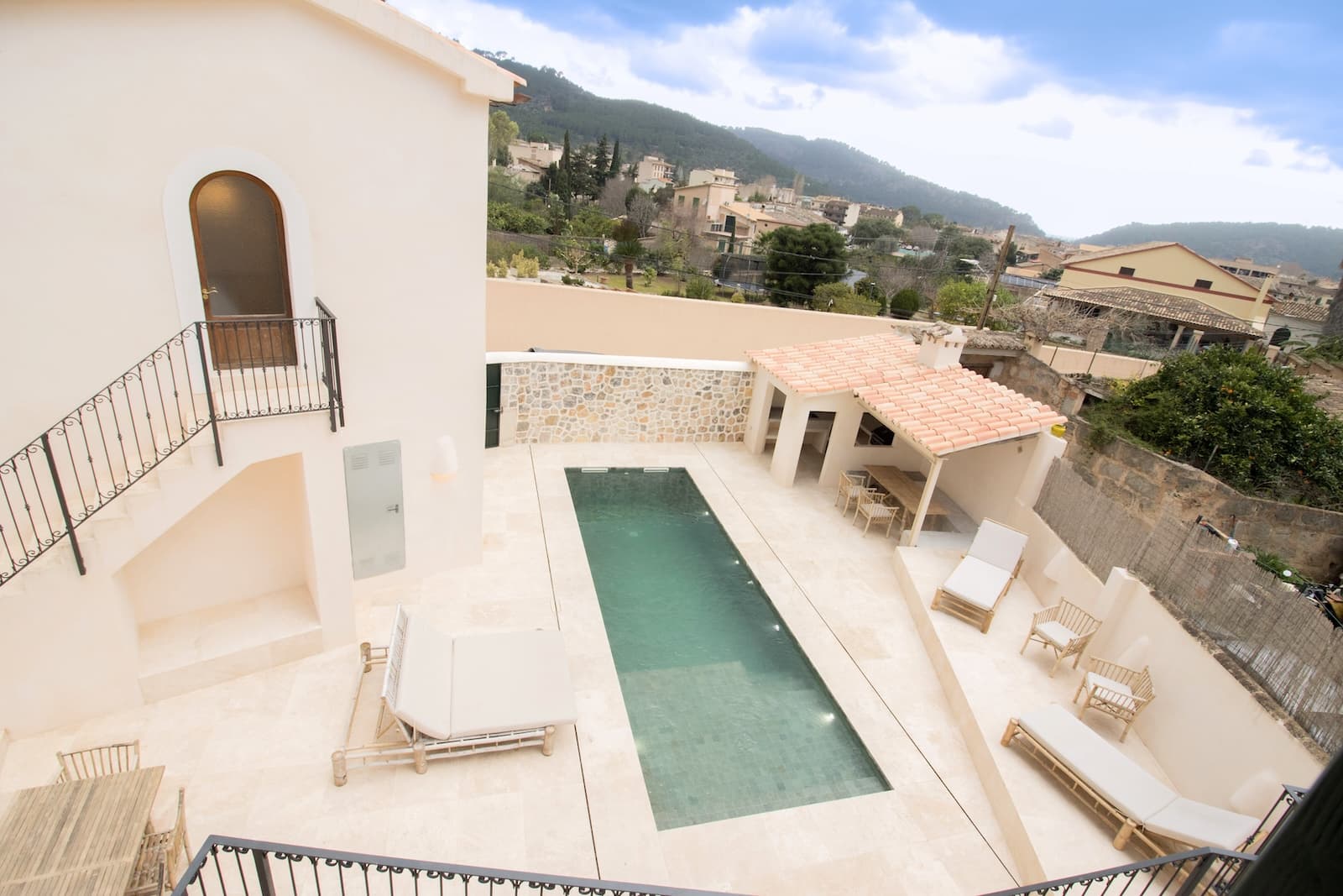 Stunningly Renovated Estate with Private Guesthouse and Pool in SóllerNestled on a tranquil street just moments from the heart of Sóller, this extraordinary property has been meticulously renovated to the highest standards. Fusing contemporary design with timeless charm, it retains the original character of its historic features, such as the exquisite hydraulic tiles and the elegant stair railing, while incorporating state-of-the-art materials and finishes.The ground floor welcomes you with a grand entrance hall, leading to an open-plan kitchen outfitted with premium appliances from top international brands. The spacious dining and living areas flow effortlessly to a private terrace, which connects seamlessly to the pristine pool area, ideal for entertaining or relaxing.On the first floor, you’ll find two sumptuous bedrooms, each with luxurious en-suite bathrooms, as well as a third bedroom with a separate bathroom that also serves as a guest toilet. Ascend to the upper floor where an additional bedroom with en-suite bath awaits, alongside a large, flexible room with its own guest toilet – perfect for use as a guest bedroom, media room, or lounge.The basement level offers a versatile space for storage as well as a dedicated machine room. It could also be used as a leisure room with direct access to the pool area.A separate building on the property includes a garage and a private guest suite with an en-suite bathroom and breathtaking views, offering complete privacy for visitors.The outdoor spaces are equally impressive, with a luxurious pool area surrounded by multiple lounging and sunbathing spaces. A fully equipped summer kitchen with BBQ and a covered dining area provide the ideal setting for al fresco dining and entertaining.This exceptional estate is truly one-of-a-kind, located in one of the most sought-after villages of the Serra de Tramuntana. Whether you seek a tranquil summer retreat or a permanent residence, this home offers the perfect balance of modern comfort, privacy, and timeless beauty.Key Features:Aerothermal underfloor heating (heat/cold pump)Air conditioningDouble-glazed windowsBuilt-in wardrobesGarageStunning pool and outdoor entertainment areasThis is a rare opportunity to own a luxurious property in the heart of Sóller—an oasis of serenity and sophistication.