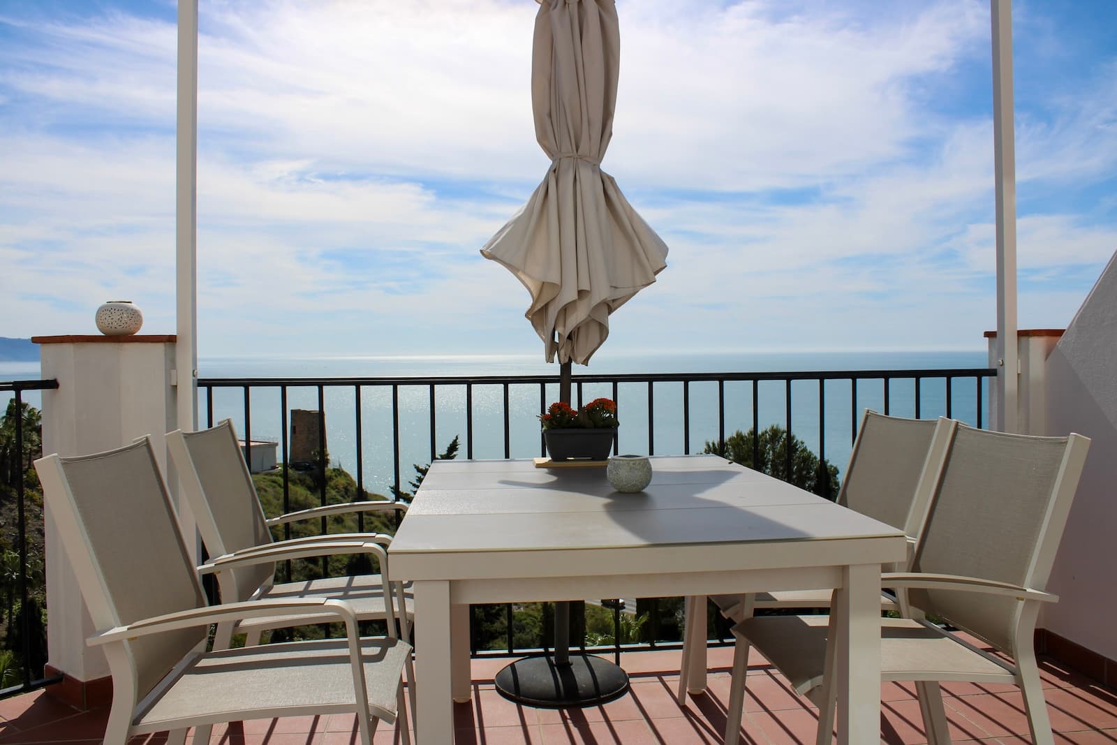NEW REALLY GOOD PRICE, €429,000Exclusive semi-detached house with roof terrace and stunning views of the Mediterranean Sea, located in the well-kept urbanization Ladera del Mar 2 between Nerja and Torrox Costa. In addition to the two wonderful terraces of a total of 58.6 m2, you have two bedrooms, two bathrooms, living room and open-plan kitchen. The house is sold fully furnished and is tastefully decorated, just move in. Tourist license is available for rent, private parking is included in the price.The house is privately located with no outside access, at the entrance there is space for flowers or a coffee table if you want. Once inside the house on the right, we have a fully equipped kitchen with open plan to the living room. From the living room you reach one of the wonderful terraces, here there is also an awning for shade during the hottest days.We continue to the left at the entrance and there we first have a bathroom, and then a bedroom. Then follows another bedroom, this bedroom has its own bathroom. From this bedroom you also reach the lovely terrace, imagine waking up to this wonderful view. Last but not least, we go up to the fantastic roof terrace, the obvious place to enjoy life.Malaga airport is a 50-minute drive away, but there is also a regular bus service from Torrox. The renowned Baviera golf course is only a 20-minute drive from your new home. In winter, Granada is only an hour and a half drive away, with skiing in the Sierra Nevada. Skiing in the morning and swimming in the afternoon, the best of both worlds.