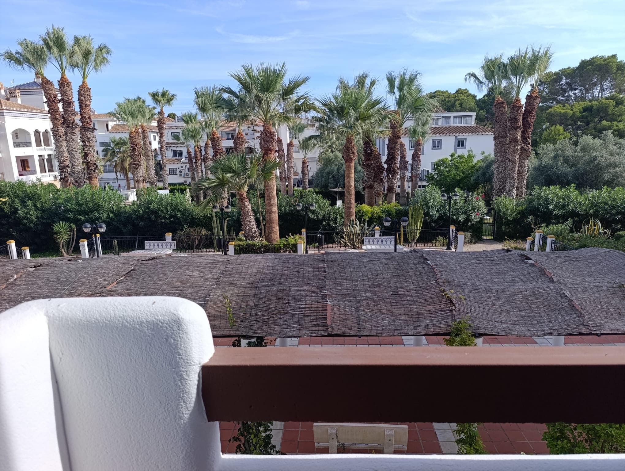 Bright Renovated Apartment in Villagolf, Villamartín – Orihuela CostaDiscover this charming, recently renovated apartment, filled with natural light and located in a peaceful setting within the exclusive Villagolf residential complex in Villamartín, Orihuela Costa.The property offers two double bedrooms with built-in wardrobes and two complete bathrooms, one of them en suite. The spacious living and dining area enjoys abundant natural light and opens onto a south-facing terrace, perfect for enjoying sunshine throughout the year. The fully equipped kitchen includes oven, microwave, induction hob, washing machine and kitchenware. Air conditioning with hot and cold function ensures comfort all year round.The apartment benefits from convenient street-level access with only a few steps. Both the terrace and the master bedroom are positioned at first-floor height, providing enhanced privacy and pleasant open views over the urbanisation and partial views of the golf course.Villagolf is a quiet and secure residential complex featuring a communal swimming pool and beautifully maintained green areas. There is direct access to Villamartín Plaza, offering a wide selection of restaurants, bars and a supermarket.Ideally located just five minutes by car from the beaches of Orihuela Costa, close to Zenia Boulevard shopping centre, with free street parking and nearby public transport.An excellent opportunity as a permanent home, holiday apartment or investment in one of the most sought-after areas of the Costa Blanca.