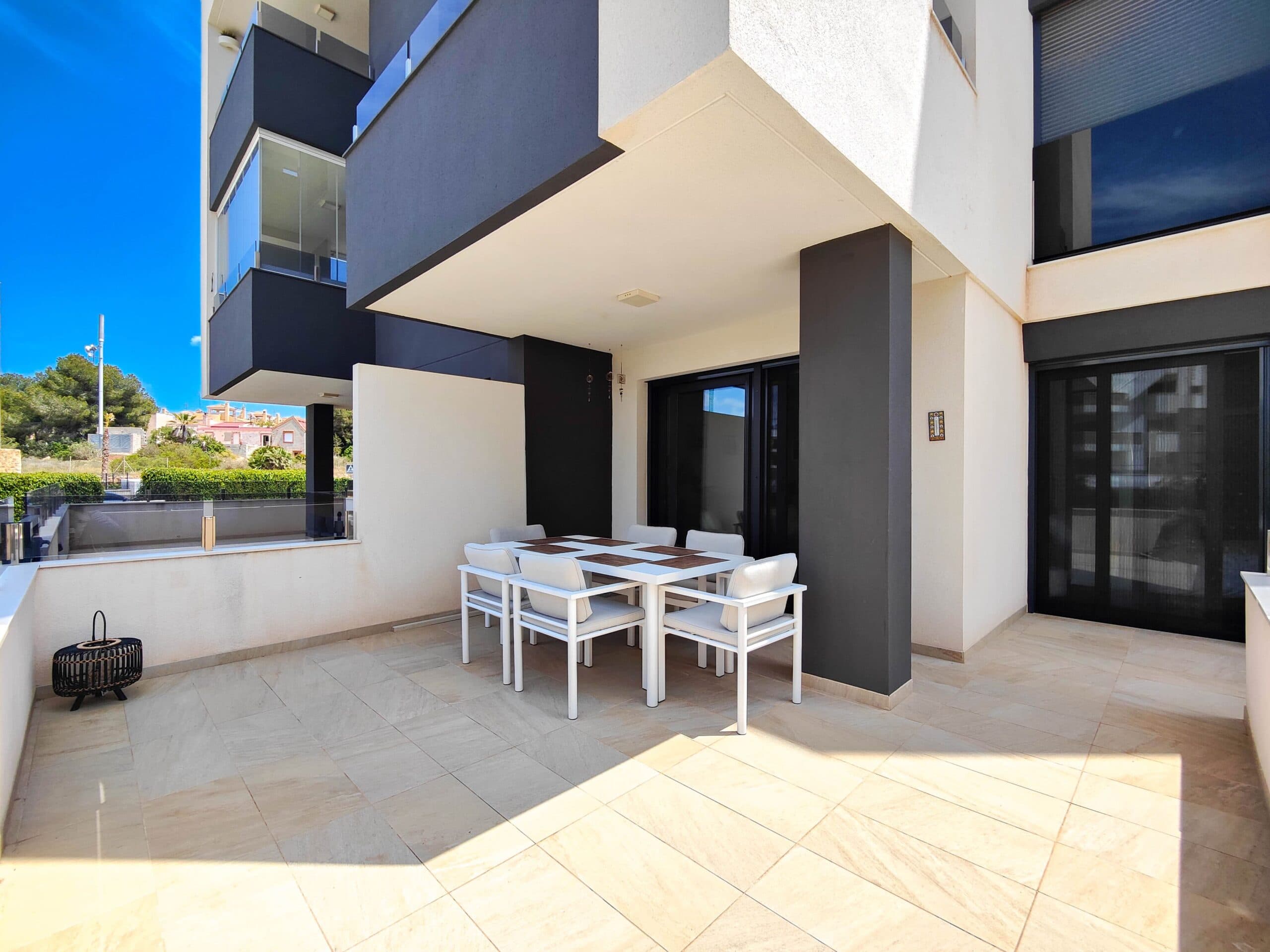 Stunning ground floor corner apartment for sale in a Res. Amanecer / Sunrise VI - Orihuela Costa.Discover this stylish and modern apartment located on the ground floor of a prestigious residential complex in Los Altos, La Florida. The property enjoys an south west facing corner terrace with direct views over the beautifully landscaped communal gardens and the swimming pool.This bright and spacious apartment features 2 bedrooms and 2 bathrooms, a contemporary open-plan living area, and a fully equipped modern kitchen with breakfast bar. The kitchen includes high-end appliances such as an oven, microwave, fridge-freezer, dishwasher, washing machine, and a ceramic hob with extractor. For added comfort, the bathrooms come with underfloor heating.Additional features include PVC windows with electric shutters (remote-controlled), central air conditioning, and the property is sold fully furnished—ready to move in.An underground parking space and a private storage room are included in the price.Set within a secure, gated community, the resort offers exceptional facilities including a large communal swimming pool, a children’s pool, palm-lined gardens with chill-out zones, a petanque court, and a complete fitness area with sauna and jacuzzi.Ideally located just steps from an Aldi supermarket, and a short drive to the renowned Zenia Boulevard Shopping Center and the beautiful beaches of Orihuela Costa.