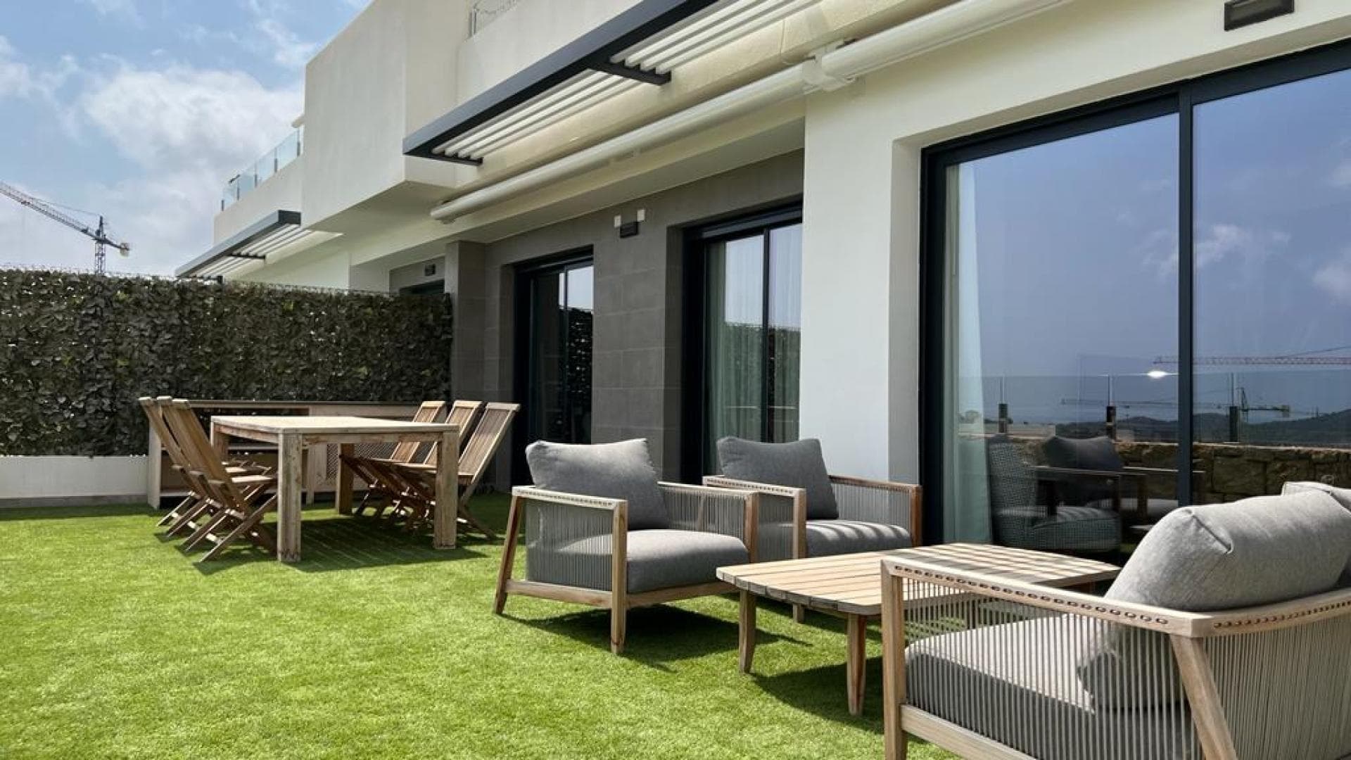 This luxury apartment is located in the beautiful Camporrosso Village complex in the coastal town of Finestrat, 3.5 km from the (sandy) beaches of Benidorm and Cala de Finestrat. These beautiful beaches are more than 6 km long, which are among the best in Europe, awarded Blue Flags by the European Union, awarded for the quality of the water, for cleanliness and the services they offer. The extensive municipality of Finestrat is located between Benidorm and Villajoyosa. The picturesque old center lies a little further inland, beautifully situated on a hill. There is a bus stop just outside the complex and there is a tram stop at the large La Marina shopping center less than 2 km away. This tram runs between Alicante and Valencia and stops in Albir and Altea.'Camporrosso Village' is a project with an impressive view of the Benidorm skyline. This community is equipped with many luxury amenities such as saunas, outdoor pool, indoor heated pool, infinity pool, spacious fitness center and much more. In short, everything to relax.The complex has a beautiful garden, a large beautifully designed outdoor pool with a separate children's pool, a large indoor pool, sauna, fitness room, paddle tennis court, children's playground, a small supermarket and a restaurant with bar/terrace.The apartment is composed of 2 bedrooms, 2 bathrooms, large living room, kitchen, gallery and a large terrace / garden, private storage room. hall type entrance and a private parking space.The apartment is sold fully furnished and equipped, including garden furniture and Jacuzzi.