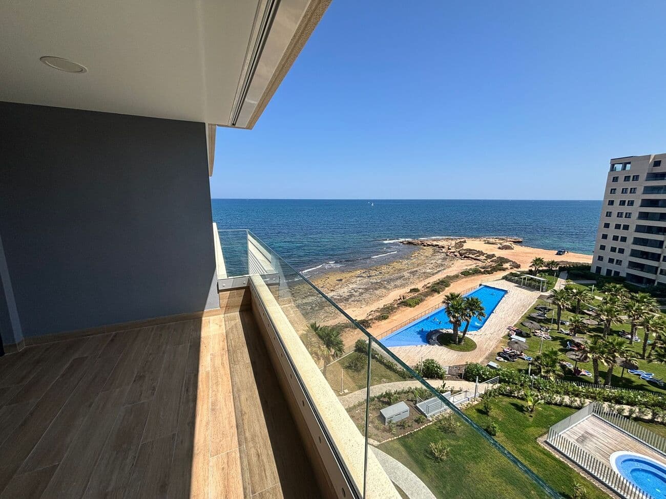 A unique opportunity to purchase a brand new apartment on the first line of the sea, with spectacular sea views! This apartment is located in the popular Punta Prima district, in a unique complex offering proximity to the sea and numerous amenities. The property comprises two bedrooms, two bathrooms, and a living area with a kitchen and living room overlooking the sea. The apartment's main feature is the large terrace offering stunning views of the sea and the complex's communal areas. The apartment is located on the 6th floor and is being sold as-is. A parking space in the underground garage and a storage unit are also included in the price.This exclusive and secure complex offers not only well-maintained green areas but also numerous amenities, such as an infinity pool, jacuzzi, and children's pool. 