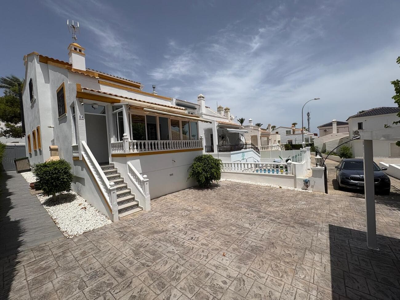 Recently reduced from €369,900A deceptively large south-facing property, this 3 bed 3 bathroom detached villa is situated in one of the most sought after locations on the Orihuela Costa – Los Dolses in Villamartin. Occupying a spacious corner plot in a quiet cul-de-sac on the beautiful Rioja I urbanisation, this home has been lovingly refurbished by the current owner to a very high standard and offers the perfect blend of traditional Spain and modern living.  Just a few minute’s walk from the La Rioja and Los Dolses Commercial Centres with a variety of shops, bars, restaurants and a supermarket with a pharmacy.  The famous Villamartin Plaza and the La Fuente Centre are also in walking distance and only a 5 minute drive away you’ll find the La Zenia Boulevard shopping centre and the amazing Blue Flag awarded beaches of the Costa Blanca – this incredible villa really does tick all of the location boxes!The villa is approached via a large front garden area which although currently used for parking, could be very easily altered to accommodate a private swimming pool and landscaped garden – just look to the neighbours for inspiration!  If you prefer to enjoy the communal pools (of which there are not one, but two!), then a private gate offers exclusive access from the property to the pools.  At either side of the property, walkways give access to a fabulous private rear garden which has been superbly appointed with a relaxing seating area with retractable awning together with a large Wellis hot tub – the perfect spot to enjoy your evening jug of sangria or a chilled glass of wine!A comfortable enclosed porch to the front of the property leads to a light, spacious and airy open plan, air-conditioned lounge which flows through to a lovely American style kitchen complete with all white goods (many of which are hidden away in the attached utility room) and the obligatory built-in wine fridge! A welcoming chill-out area is situated at the rear of the kitchen and benefits from a real wood-burning stove for those cooler, cozy winter evenings, whilst full-width patio doors offer access out to the rear relaxation area.  There is also a ground floor double bedroom which enjoys air-conditioning, built-in wardrobes and double doors which lead out to the rear garden area.  A fully modernised bathroom complete with bath and shower completes the downstairs accommodation of this great villa.Stairs lead off the lounge to the first floor where you will find two large double bedrooms, both of which enjoy the benefit of air-conditioning, walk-in wardrobes and modern en-suite bathrooms, whilst the main bedroom also gives access  to the large south-facing balcony area providing fantastic views to the Mediterranean sea in the distance.Unusually, the villa also benefits from mains gas fired central heating in addition to hot and cold air conditioning throughout.Location, quality and value combine to make this property a truly exceptional prospect for anyone seeking the ultimate villa with easy access to all that the Costa Blanca has to offer – walking distance to the best bars, restaurants and shopping and only a few minutes drive from the Mediterranean and  those golden beaches – what more could you want?